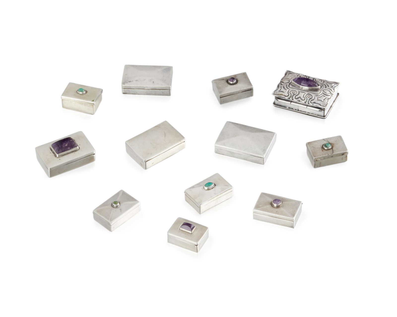 Twelve Fred Davis silver and gem-set pillboxes: Second quarter 20th century; Mexico City, Mexico Each stamped for Fred Davis; Some stamped: Sterling Comprising three plain silver boxes, five boxes set with amethyst cabochons, and four set with gree