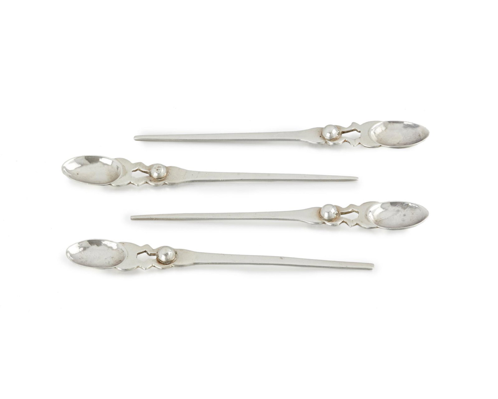 Four William Spratling silver child's spoons: 1940-1944; First Design Period; Taxco, Mexico Each stamped for William Spratling; Further stamped: Spratling Silver Each with tapering handle, 4 pieces Each: 5.25" H 1.960 oz. troy approximately Prove