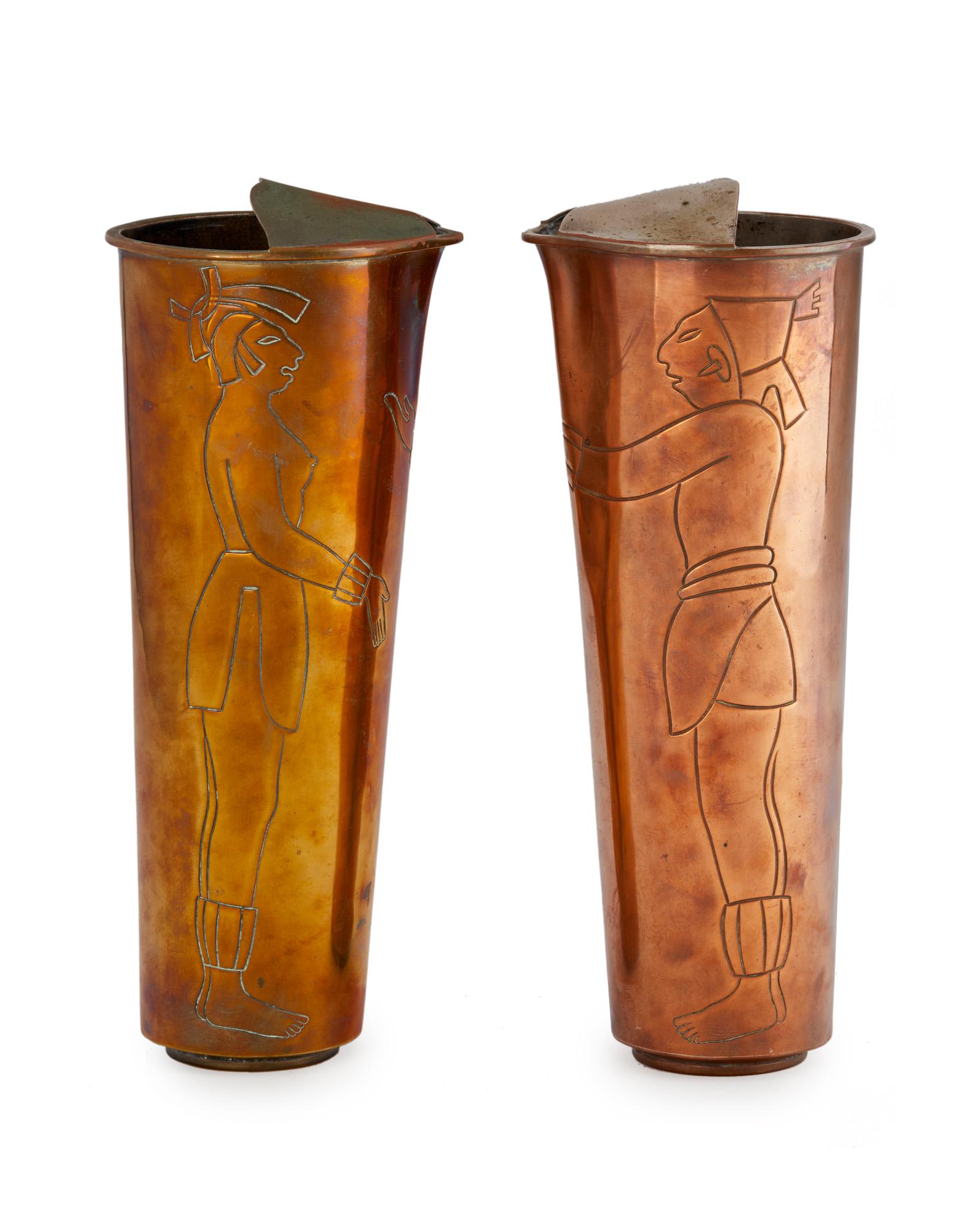 Two Los Castillo mixed-metal cocktail pitchers: Third quarter 20th century; Taxco, Mexico Each stamped for Los Castillo; Further stamped: Handwrought Each with incised Pre-Columbian figures, 2 pieces Each approximately: 12" H x 4.5" W x 4.875" D Pr