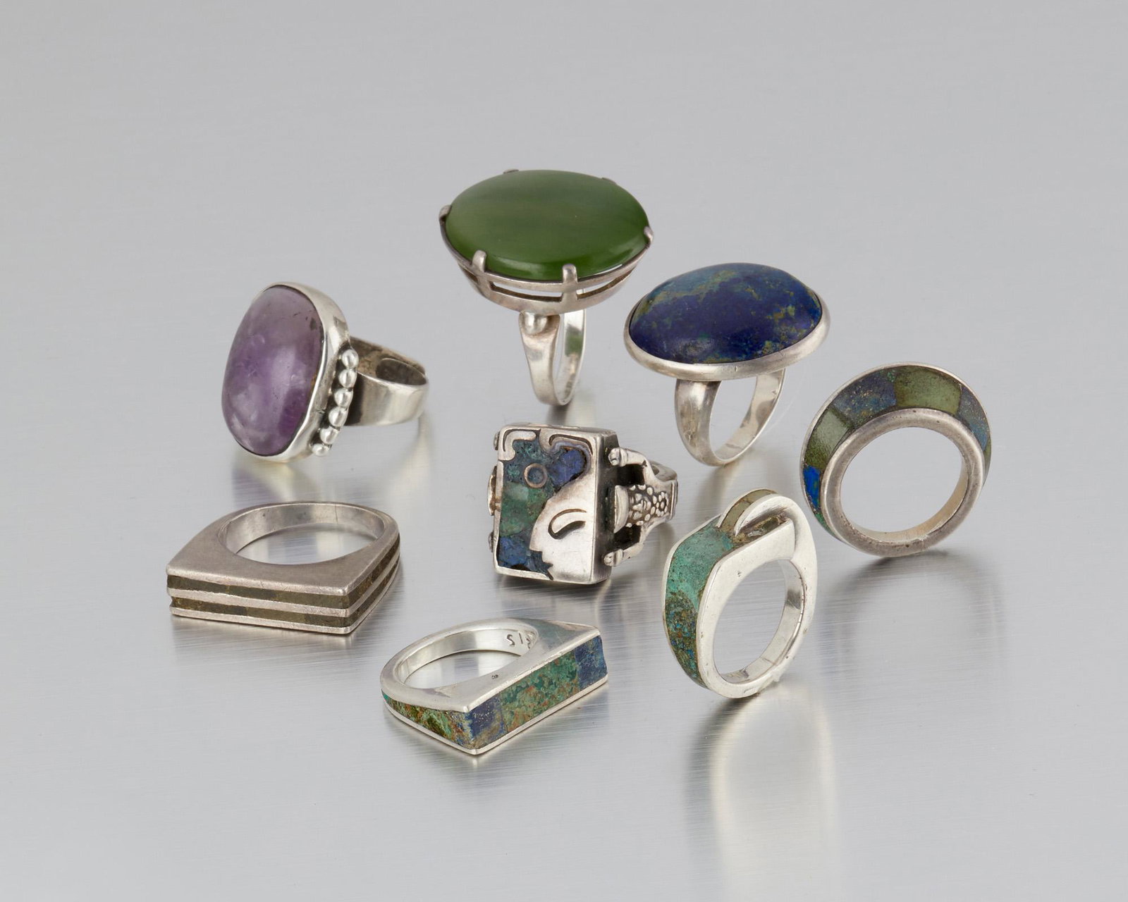 A group of Los Castillo silver and gem-set rings: 1939-1945 and 1948-1965; Taxco, Mexico Stamped: Los Castillo; Indistinct Eagle; Eagle 15; Each variously stamped: Taxco / Made in Mexico / Sterling / Mosaico Azteca / 132 / 925 / 215 / 223; One attrib