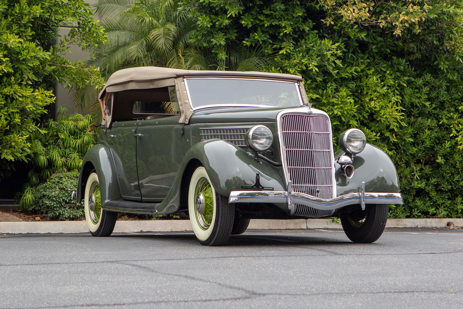 A 1935 Ford V8 Deluxe Phaeton: VIN: 181309458 Model 48, 85hp, 221ci L-head V-8 engine, three-speed manual transmission, faithfully restored example with engine and transmission rebuilt in the 1980s, includes new convertible top an