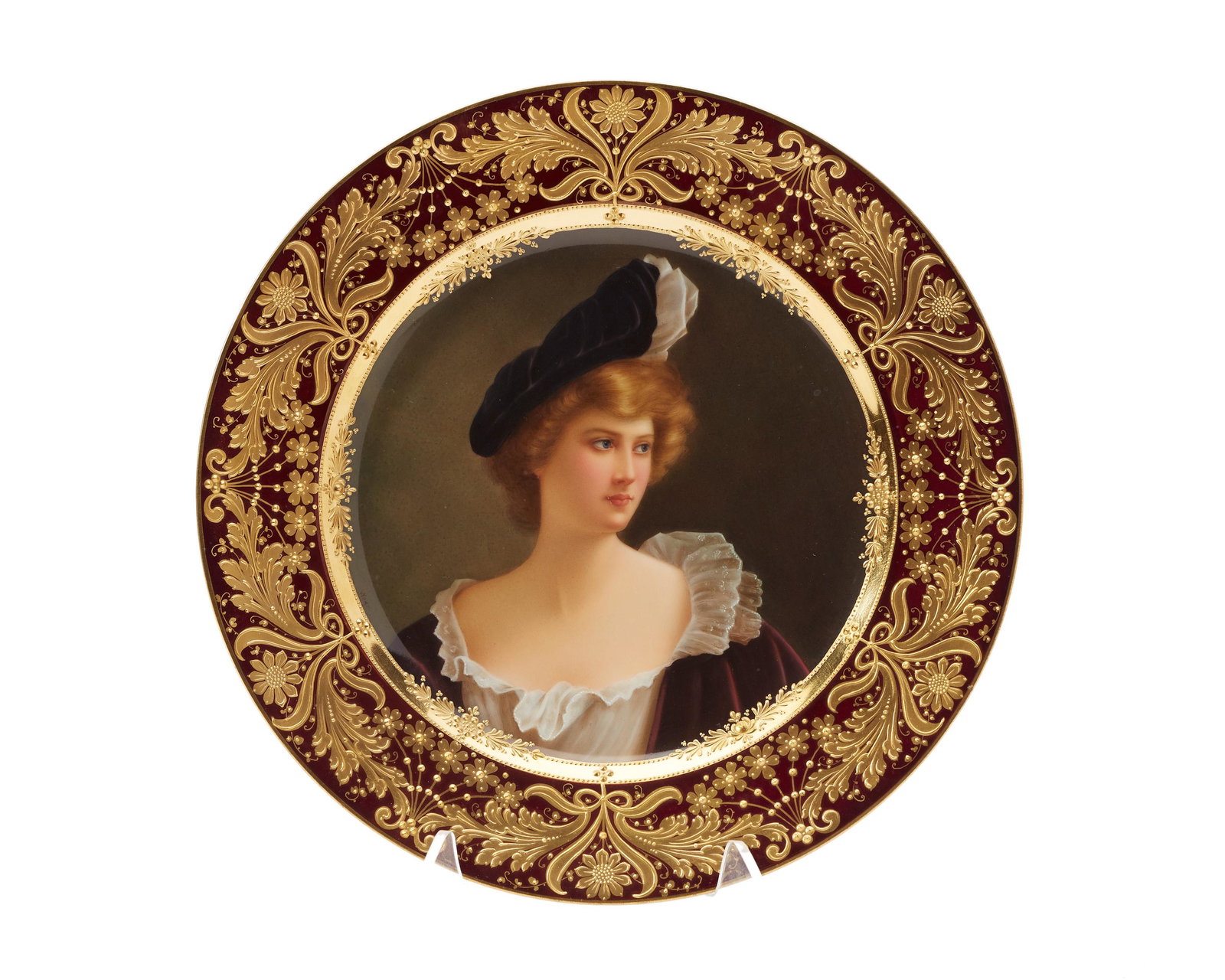 A Royal Vienna-style cabinet plate: 20th century Blue Royal Vienna-style underglaze mark; Signed and numbered: Germany / 06603; Titled verso: Cleopatra Centering a portrait of a woman in renaissance dress enclosed in a gilt-floral borde