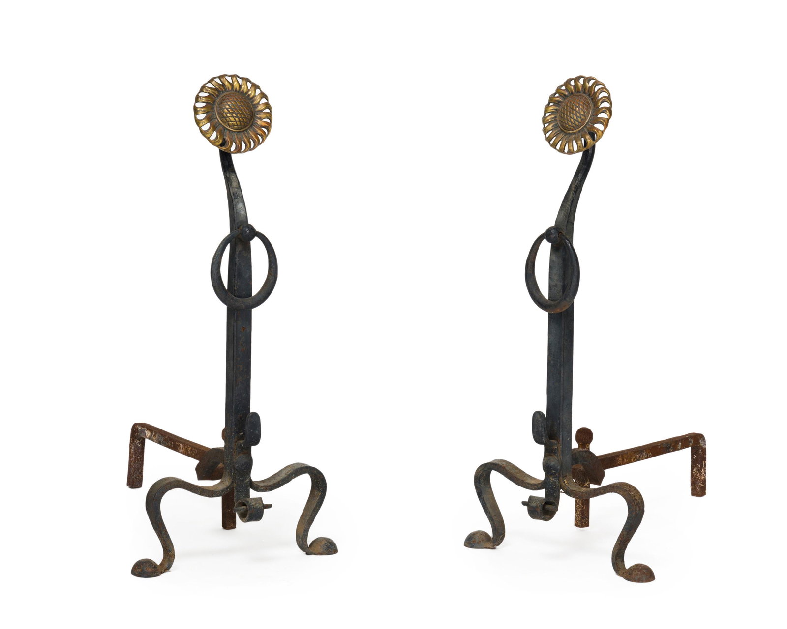 A pair of wrought iron and brass andirons: Fourth quarter 19th century Each with a stylized brass sunflower over a scrolled wrought iron base with wrought iron rings Each: 31.5" H x 14.5" W x 25.25" D