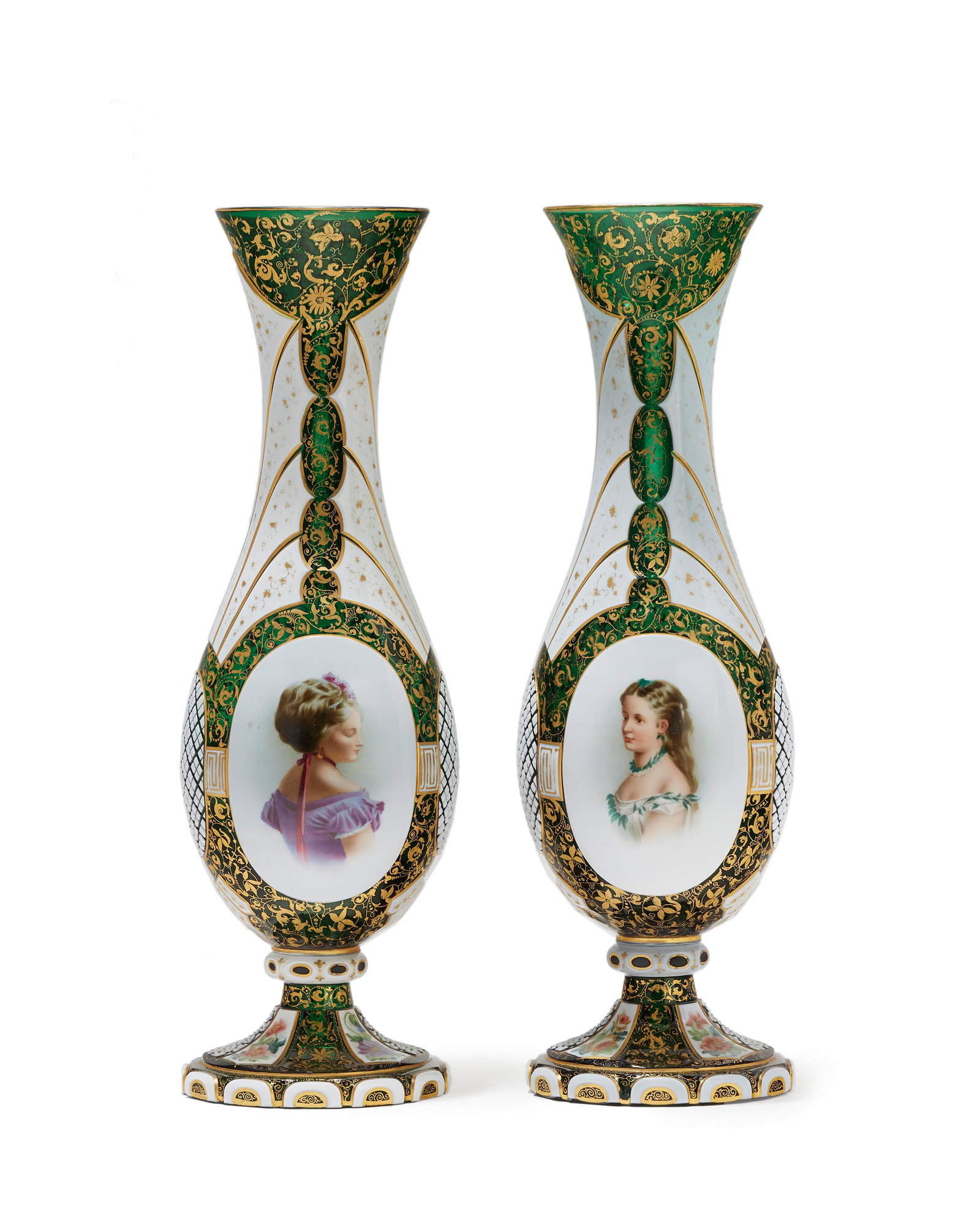 A pair of Bohemian cut-glass portrait vases: Late 19th/early 20th century Each of white glass cut to green centering a portrait panel further adorned with gilt highlights, 2 pieces Each approximately: 17.5" H x 6" Dia.