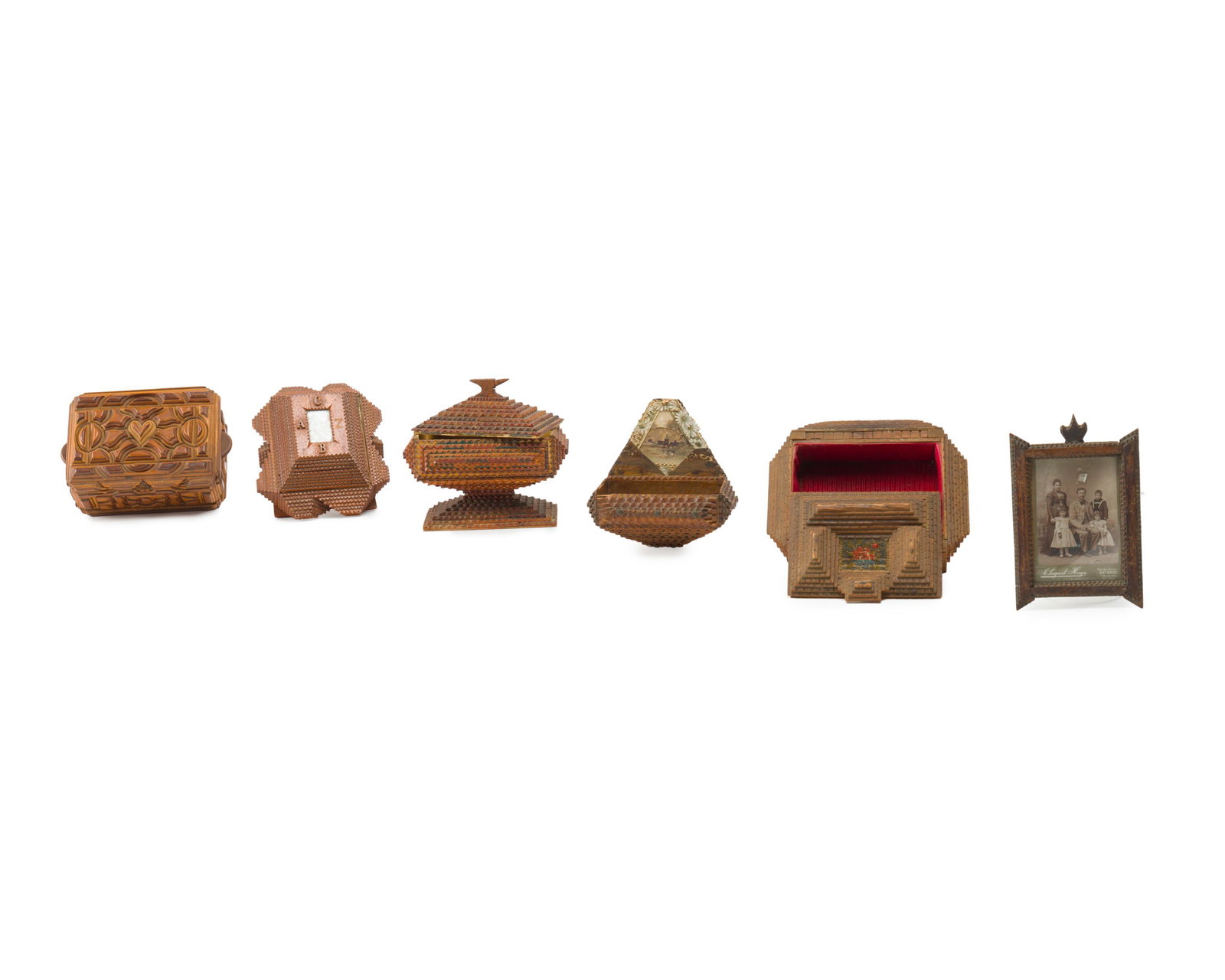 A group of chip-carved tramp art items: Late 19th/early 20th century Comprising four boxes, one wall shelf, and one picture frame, 6 pieces Tallest: 9.5" H x 8.5" W x 5.5" D