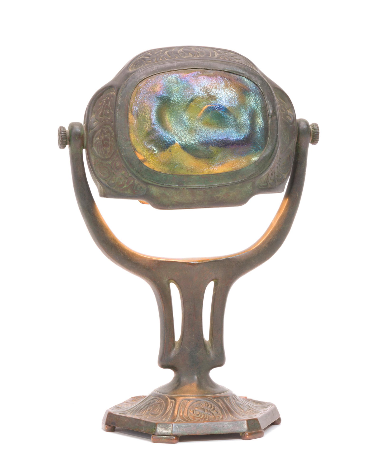 A Tiffany Studios "Zodiac" turtleback desk lamp: First-quarter 20th century Stamped: Tiffany Studios / New York / 541 The turtleback jewels in green, blue, pink, and gold tones set in a "Zodiac" pattern swiveling brass fixture with a trident shaped 