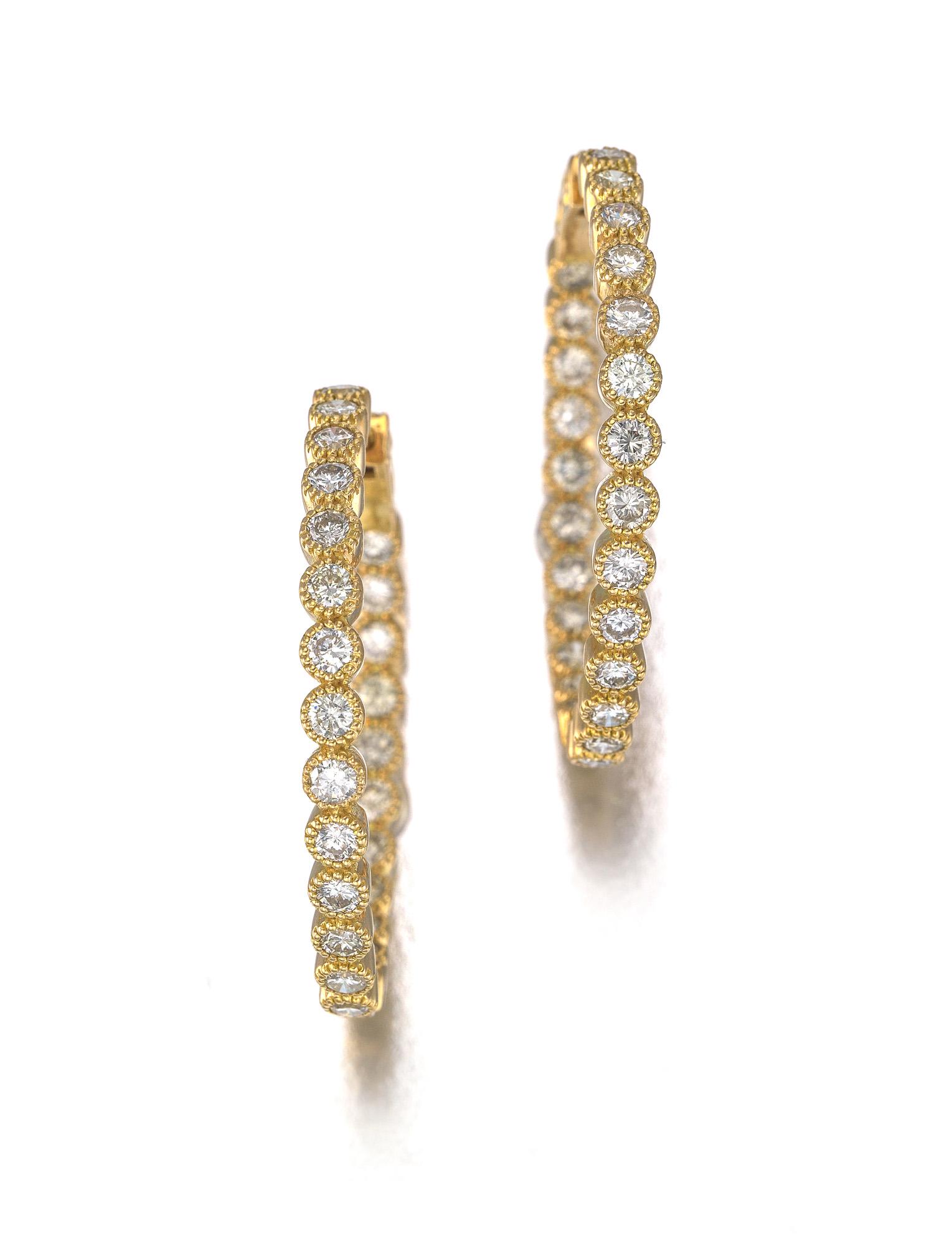 A pair of diamond hoop earrings: 18k rose gold Set with fifty full-cut round diamonds totaling 4.46 cts. and graded I-J color, VS-SI clarity 1.5" Dia. 13.5 grams 2 pieces