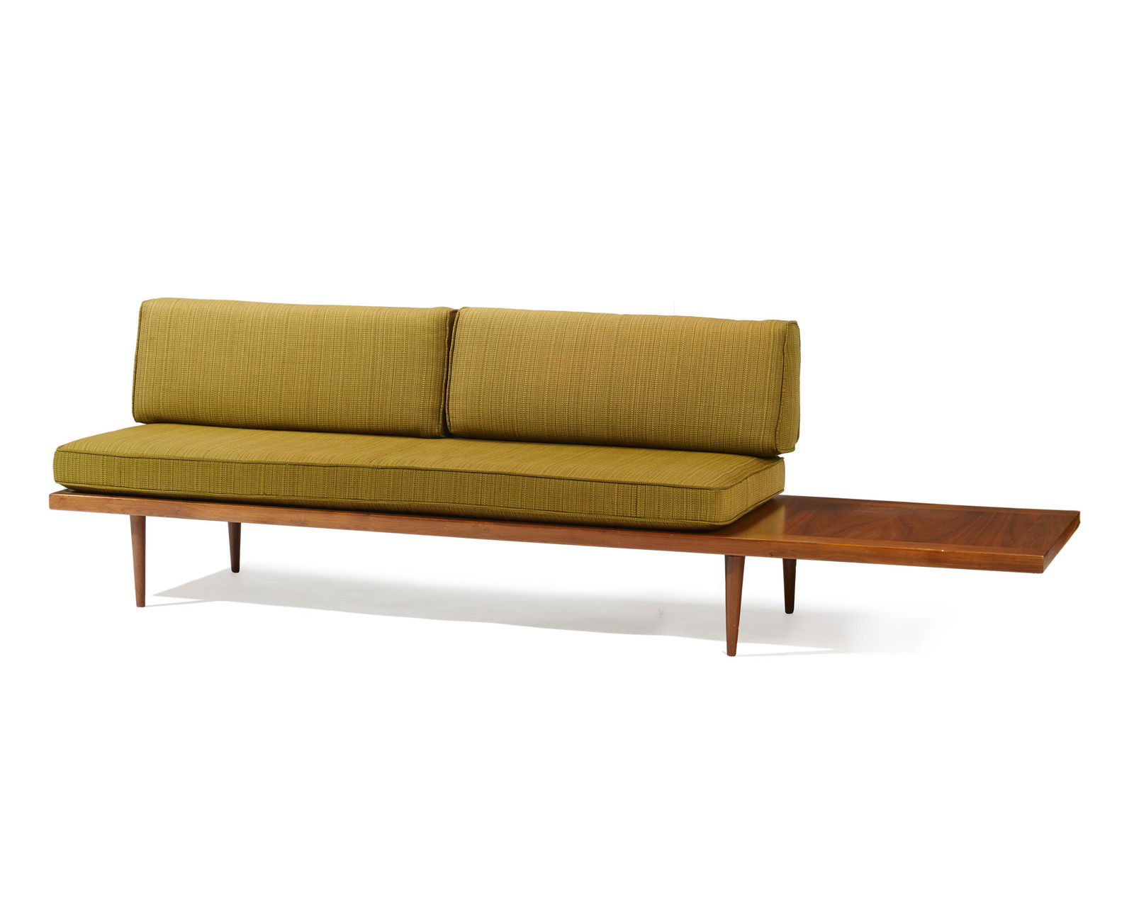 A George Nelson-style platform sofa: 1950s The green upholstered sofa bench with two back pillows and a side table Overall: 31" H x 130" W x 30" D; Sofa 31" H x 73" W