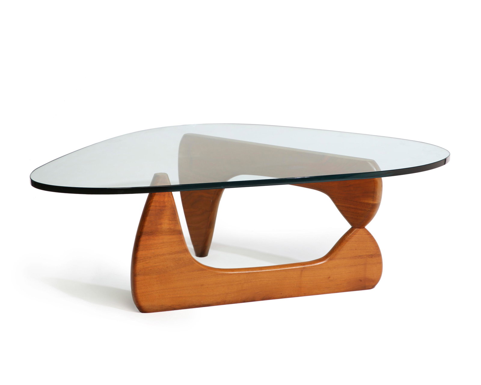 A Noguchi-style cocktail table: Mid-20th century Unmarked The classic IN-50 style low table in natural wood with a rounded-triangular glass top 15" H x 30" W x 30.5" D
