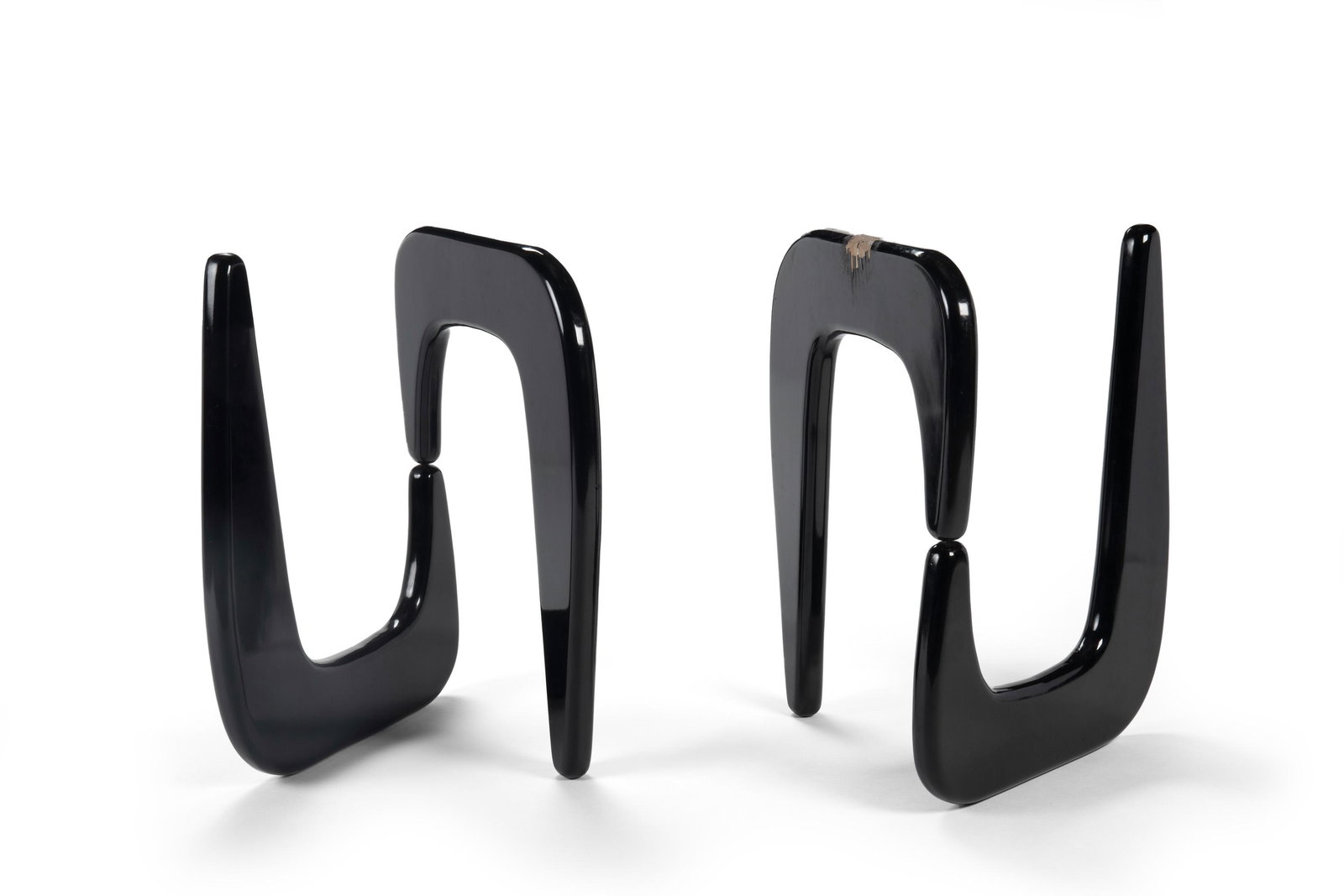 Two Isamu Noguchi-style side table bases: Mid-20th Century Both impressed: 1940; One further impressed: Isamu Noguchi Both black veneered side tables in the IN-50 style, 2 pieces Each base: 29.5" H x 21.5" W x 22" D Provenance: The Collection
