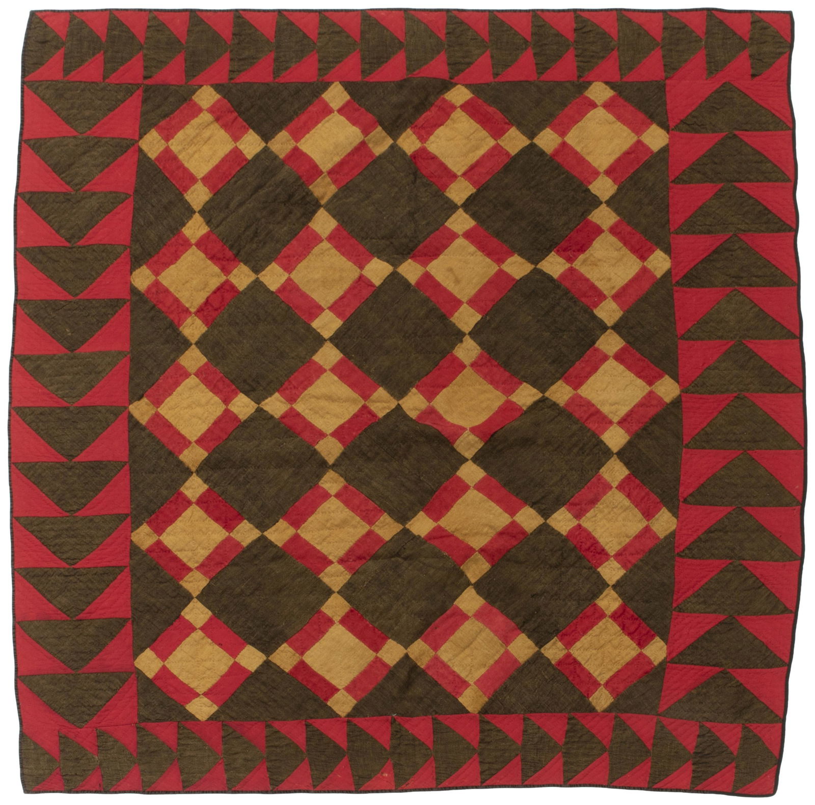 An Amish Nine Patch and Flying Geese quilt: Circa 1905, Iowa Wool and cotton with red and mustard nine patch blocks on a brown field, a brown and red flying geese border, and a black velvet binding edge with a red wool backing 65" H x 68" W