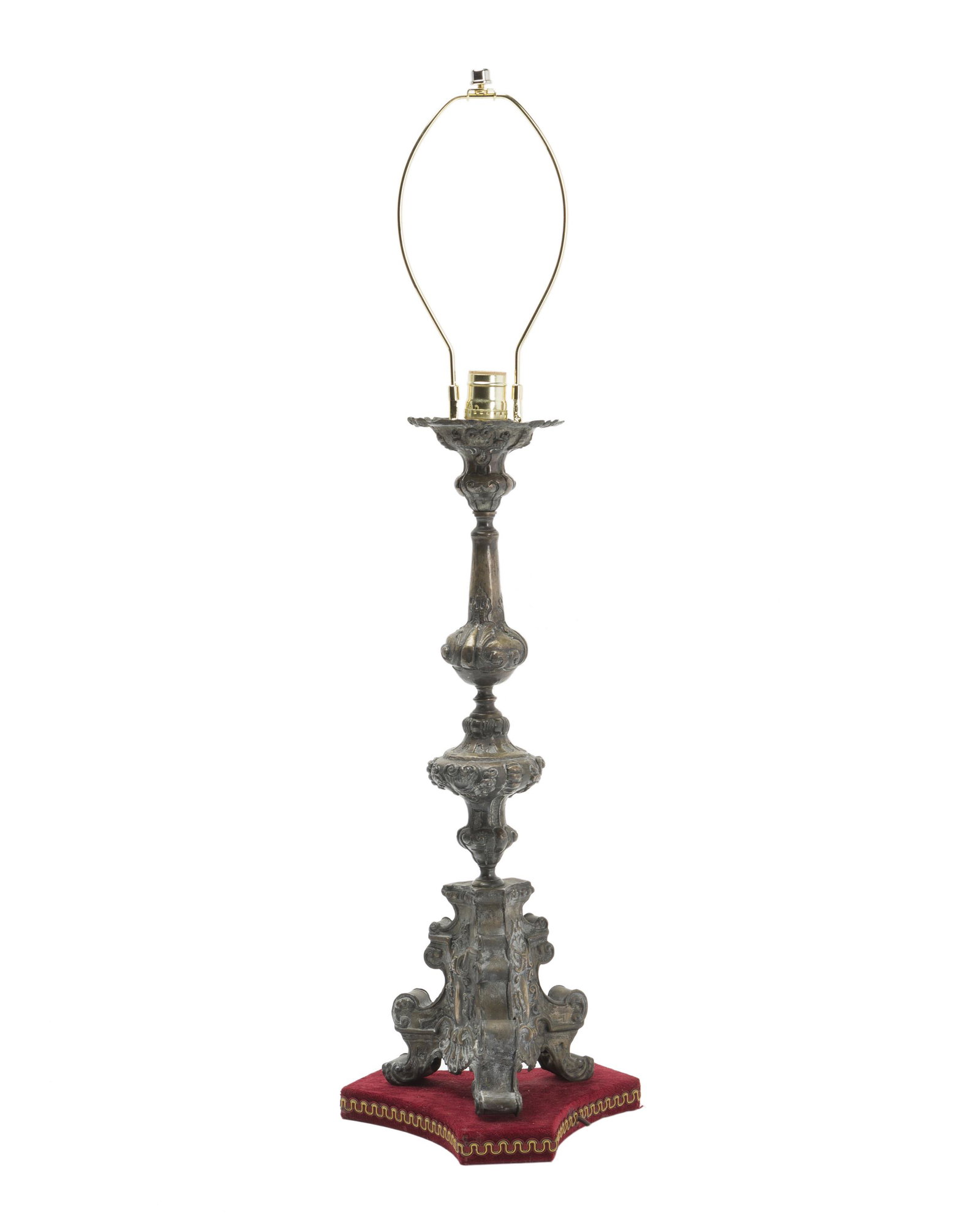 An Italian Renaissance Revival table lamp: 19th Century or earlier The single-light lamp over a metal standard converted from a pricket stick raised on a velvet base, electrified 33.25" H x 9.75" W x 9.75" D