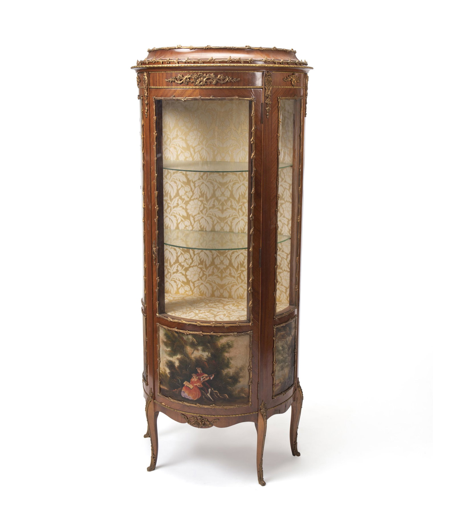 A Vernis Martin-style vitrine: Early-20th Century Apparently unmarked The rounded-front cabinet with floral brass mounts, beige floral fabric interior, and two glass shelves over painted pastoral scenes and cabriole legs 68" H x 27