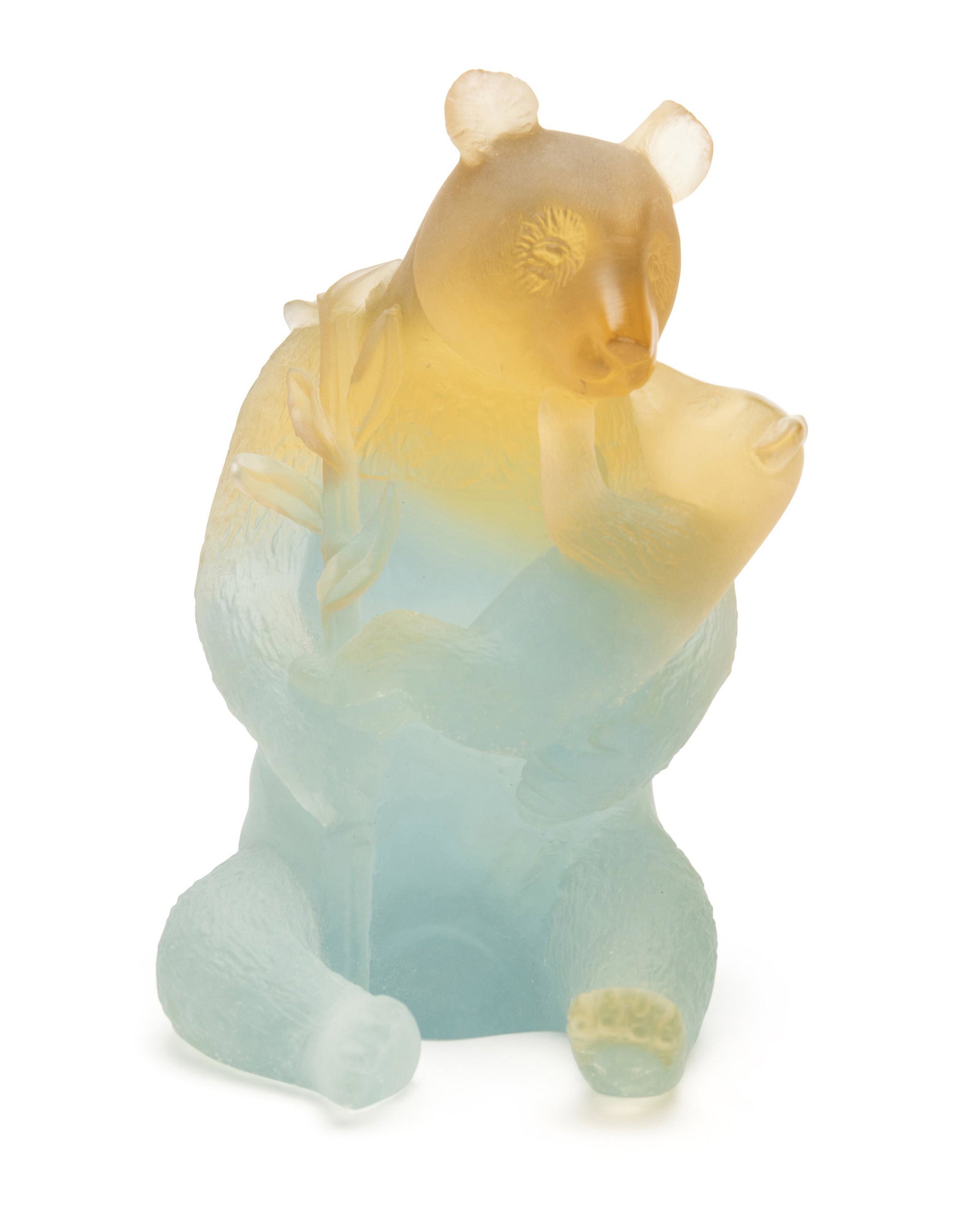 A Daum pate de verre panda: Fourth-quarter 20th Century Etched to base: Daum France 228 The glass sculpture of a mother and baby panda with bamboo leaves in blue and orange 6.5" H x 4.25" W x 5" D Provenance: Property from a Nor