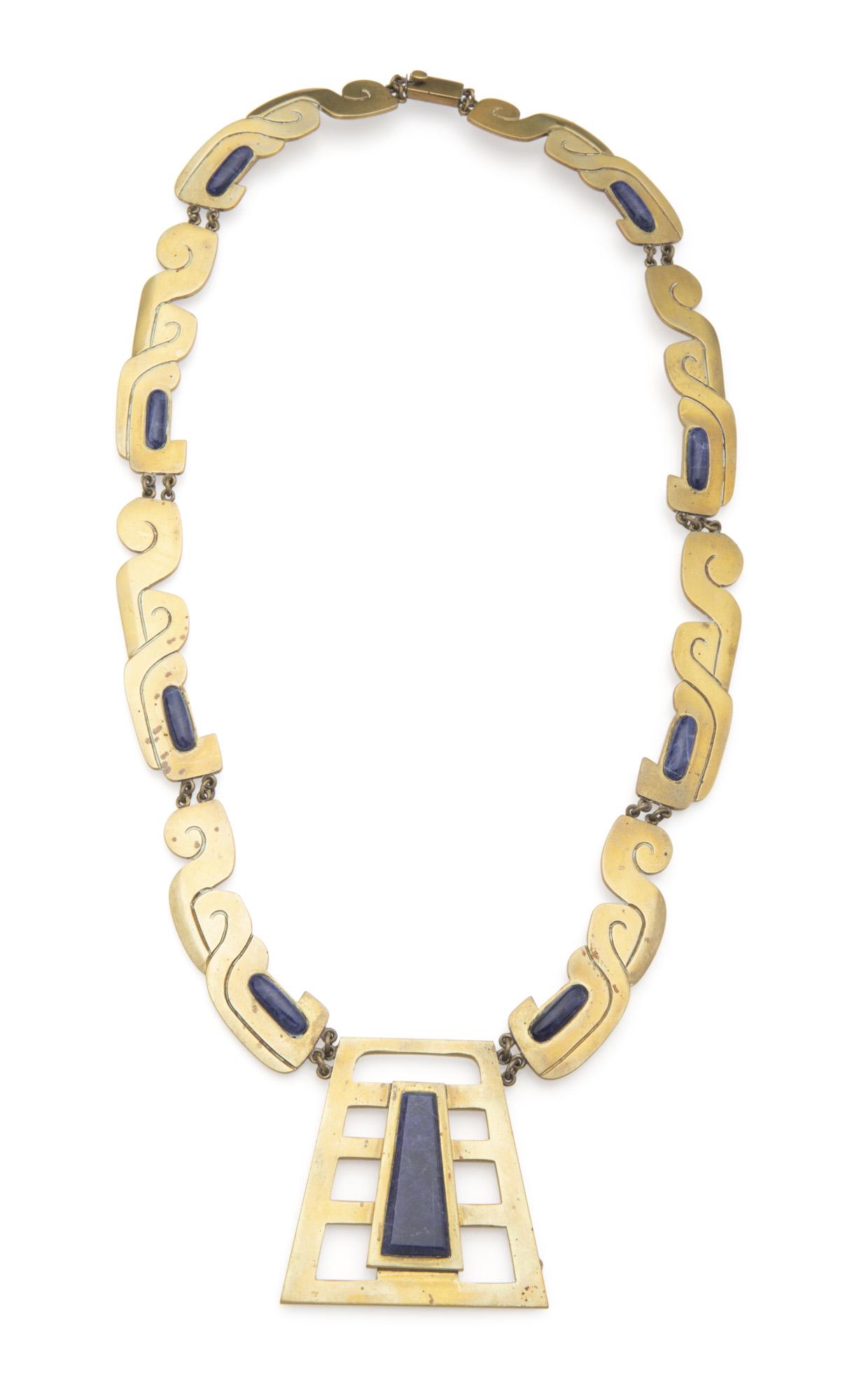 An Erika Hult de Corral brass and sodalite necklace: Third-quarter 20th Century Stamped: Ric / Hecho en Mexico / Laton / 035 The Mixtec-inspired links suspending a stepped pendant and further set with sodalite cabochons 25.5" L x 2.325" H x 2.325" W