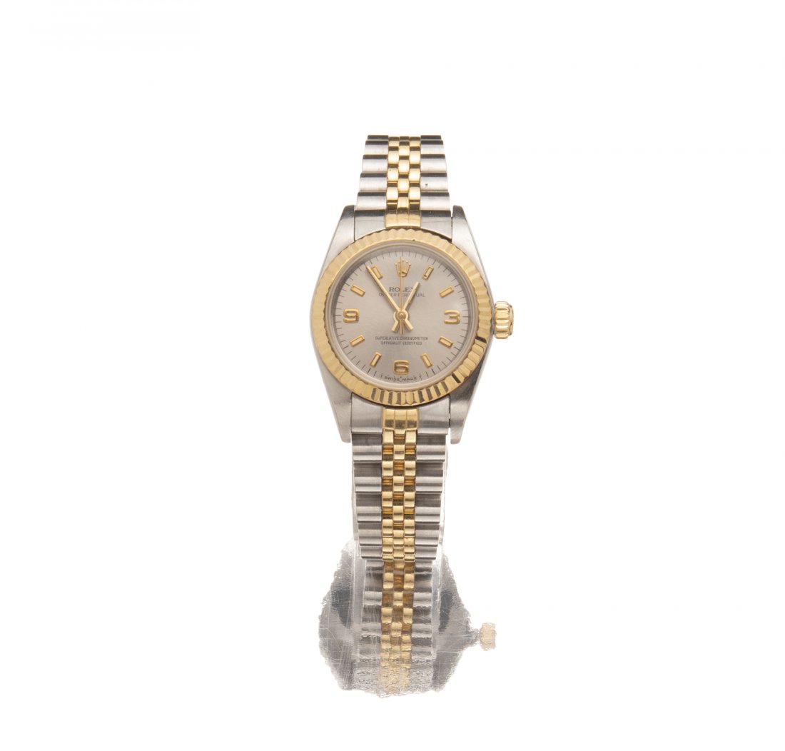 A ladies Rolex Oyster Perpetual wrist watch: 1995 Ref: 67193 Dial: Silvered dial applied polished gilt baton hour markers with luminous and Arabic numerals, signed: Rolex / Oyster Perpetual / Superlative Chronometer / Officially Certified, bat