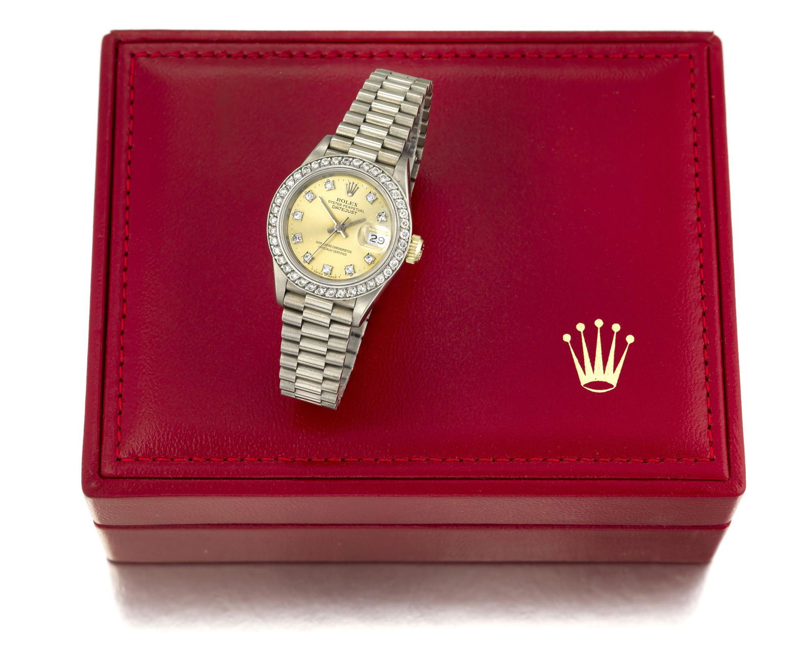 A ladies Rolex Presidential wristwatch: 18k white gold Ref: 69179 Dial: Champagne dial, custom diamond hour markers, date aperture, signed: Rolex / Oyster Perpetual / Datejust / Superlative Chronometer / Officially Certified, baton hands