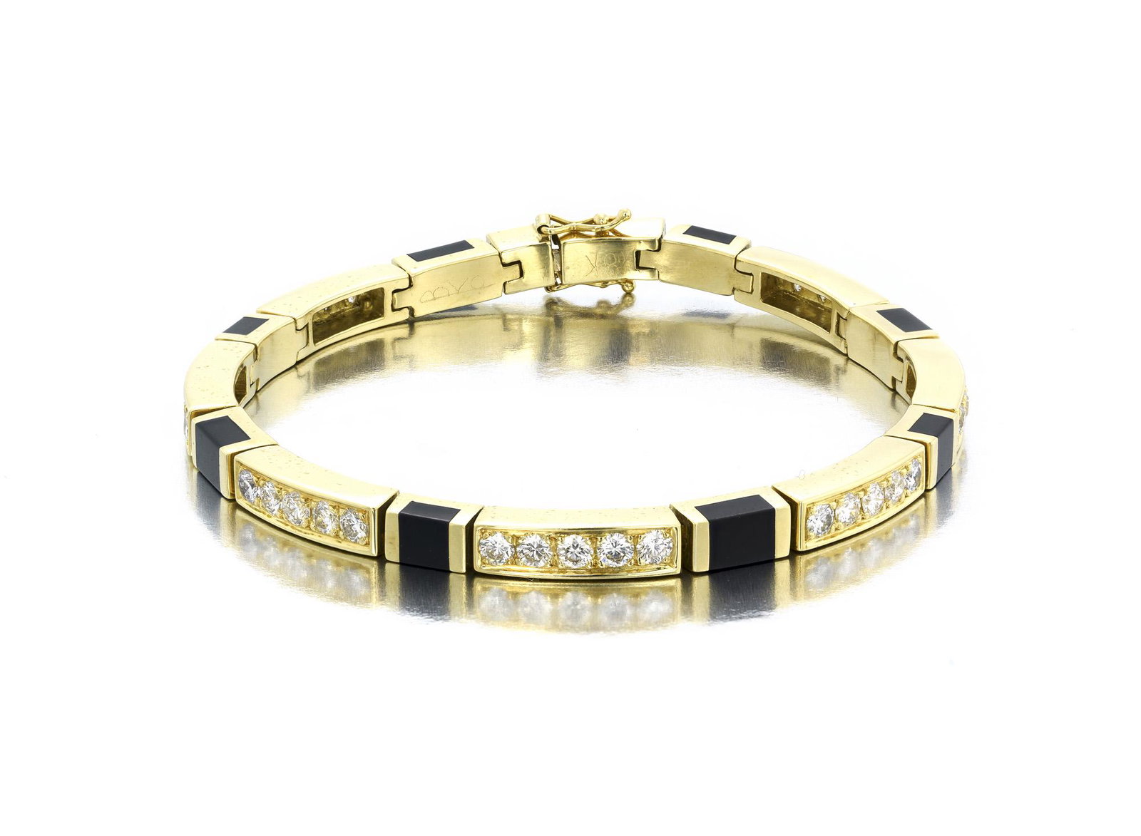 A Bernard Passman black coral and diamond bracelet: 18k yellow gold Set with bands of black coral and diamond links with thirty-five full-cut round diamonds totaling approximately 2.40 cts. and graded H-I color, VS clarity together with the original br