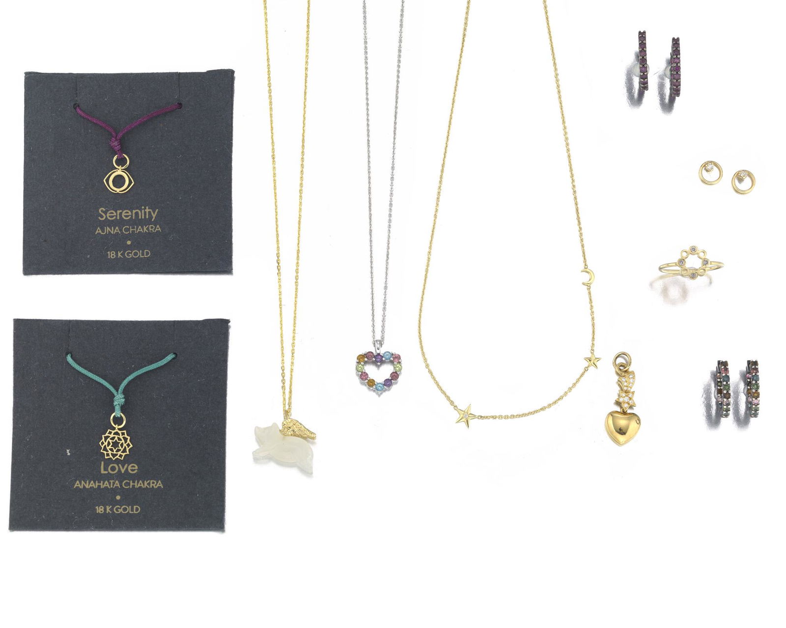 A group of jewelry: Comprising two pairs of oxidized gold and gem-set hoop earrings by Nina Guyen (5/8" H x 3/4" W); A gold toned silver and pig necklace (17 1/2" L x 1/2" H x 3/4" W); A 14k yellow gold ring (6.25); A pa