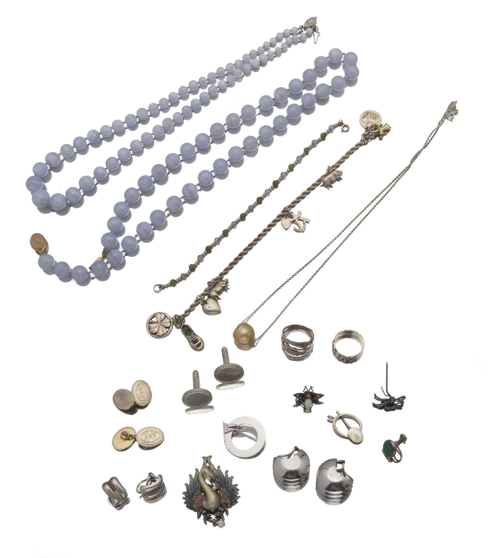 A group of silver jewelry: Comprising three bead necklaces, a flower ring, a stylized bird ring, a charm bracelet, a single malachite earring, a pair of Tiffany & Co. cufflinks, a pair of vermeil cufflinks, a pair of huggie-sty