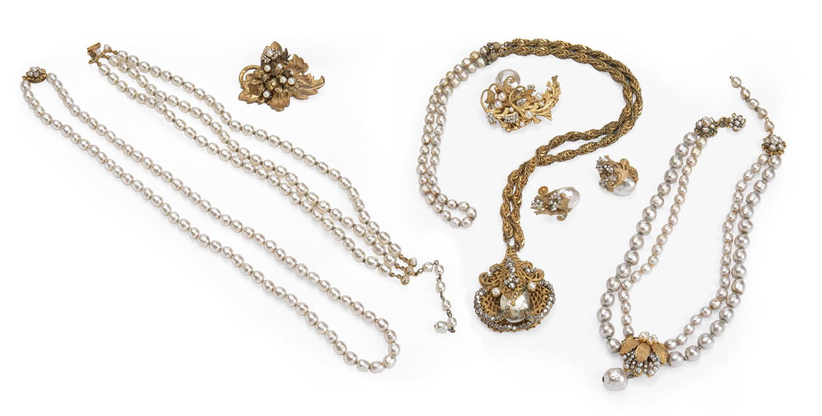 A group of Miriam Haskell jewelry: Comprising a maple leaf brooch, a triple strand of pearls, a single strand of pearls, a suite of metal and pearl with earrings and brooch, and a double-strand with drop Longest: 32" L 8 pieces