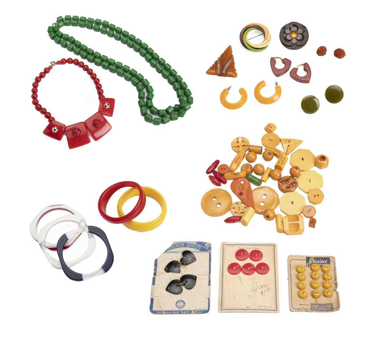 A group of Bakelite and plastic jewelry: Comprising two necklaces, five bangle bracelets, four pairs of earrings, two brooches, two clips, and a selection of buttons Longest necklace: 56" L; Largest brooch: 2 1/8" Dia.
