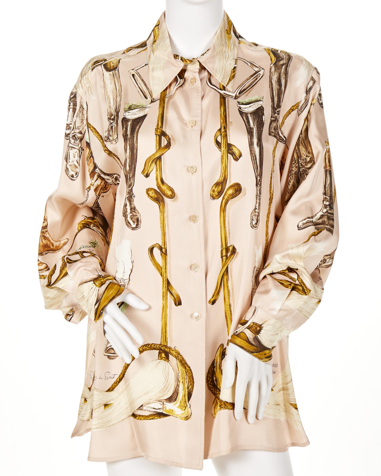 An Hermes "A Propos de Bottes" silk blouse: Third quarter 20th century Fabric label: Hermes Paris Designed by Xavier de Poret in an equestrian motif Size 46