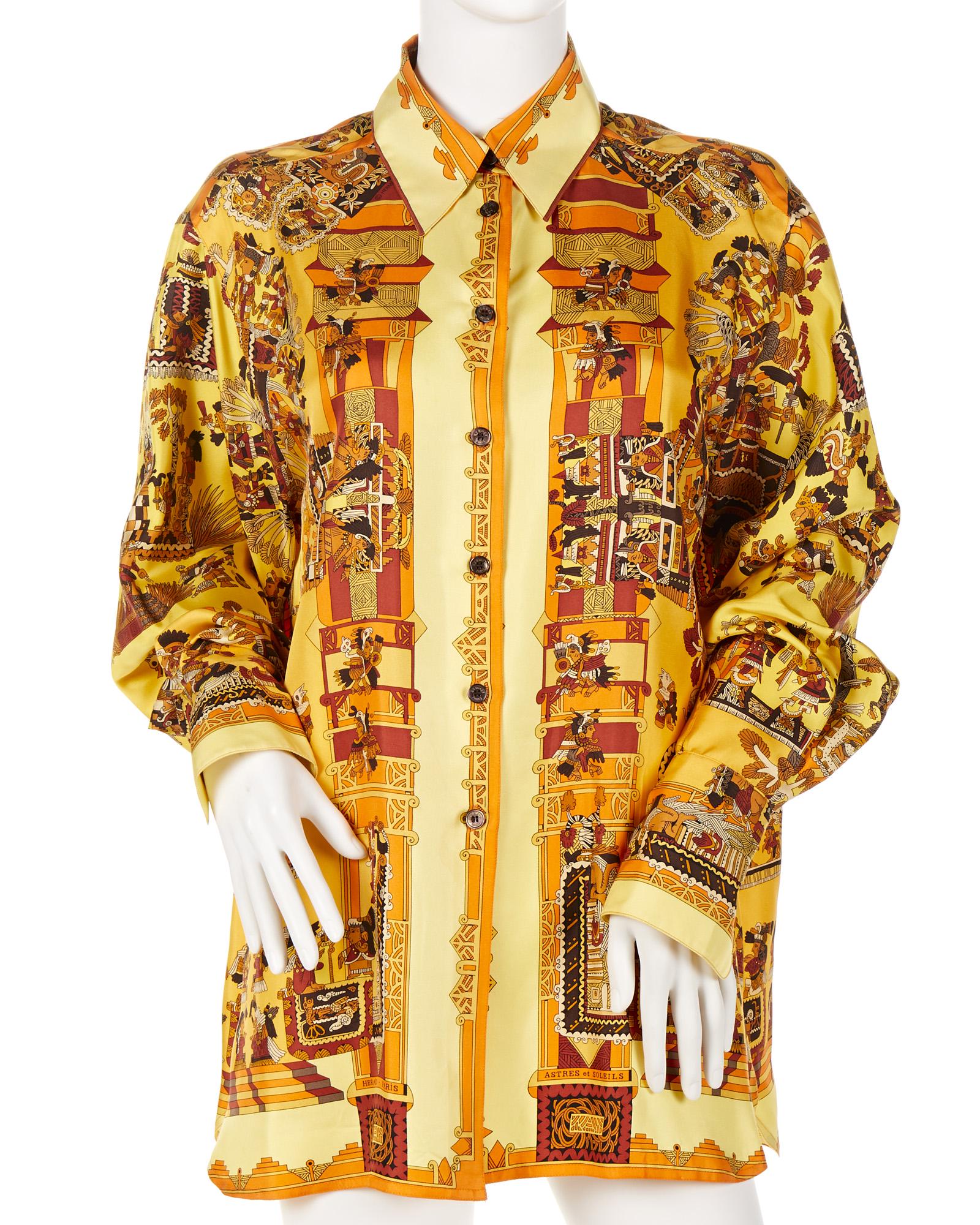 An Hermes "Astres et Soleils" silk blouse: Fourth quarter 20th century Fabric label: Hermes Paris Designed by Annie Faivre Size 42
