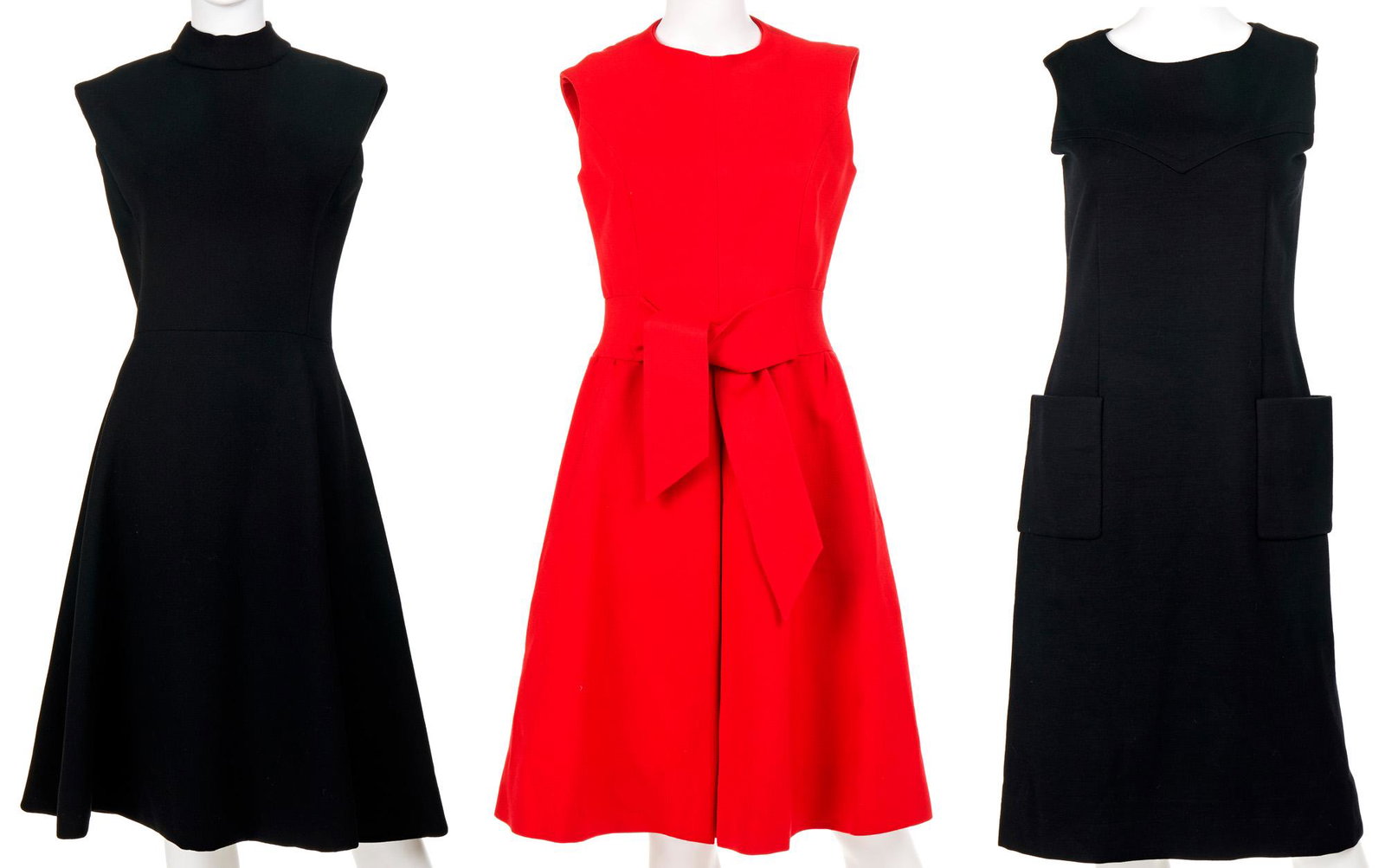 Three sleeveless day dresses: Circa 1960s Each with fabric label Comprising a red Sybil Connolly dress, a black Norman Norell dress, and a black Pauline Trigere dress, 3 pieces