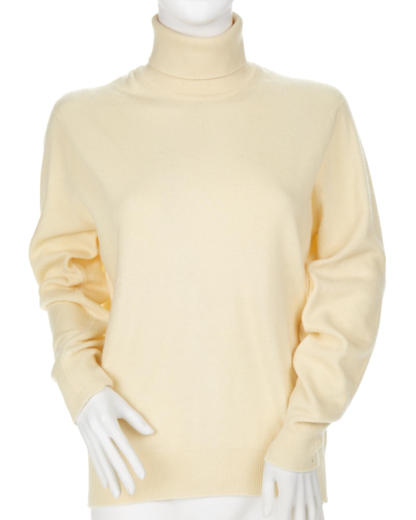 A cream Hermes turtleneck sweater: Third quarter 20th century Fabric label: Hermes Paris / 100% Cashmere / Made in Scotland Size 42