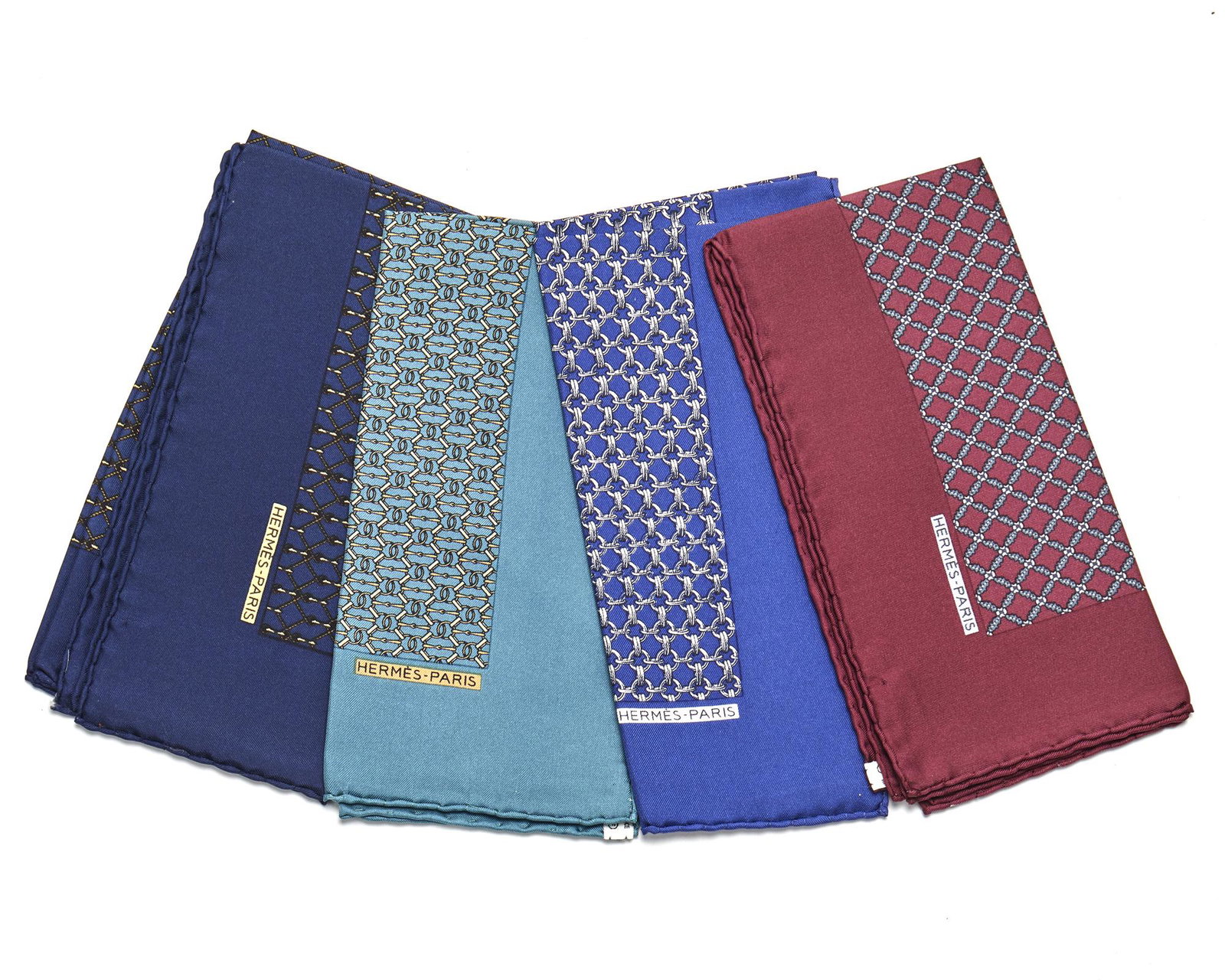 Four Hermes pocketsquares: Fourth quarter 20th century Fabric label: Hermes Comprising blue link, teal link, burgundy link, and navy and gold link, 4 pieces Each approximately: 16.5" H x 16.5" W