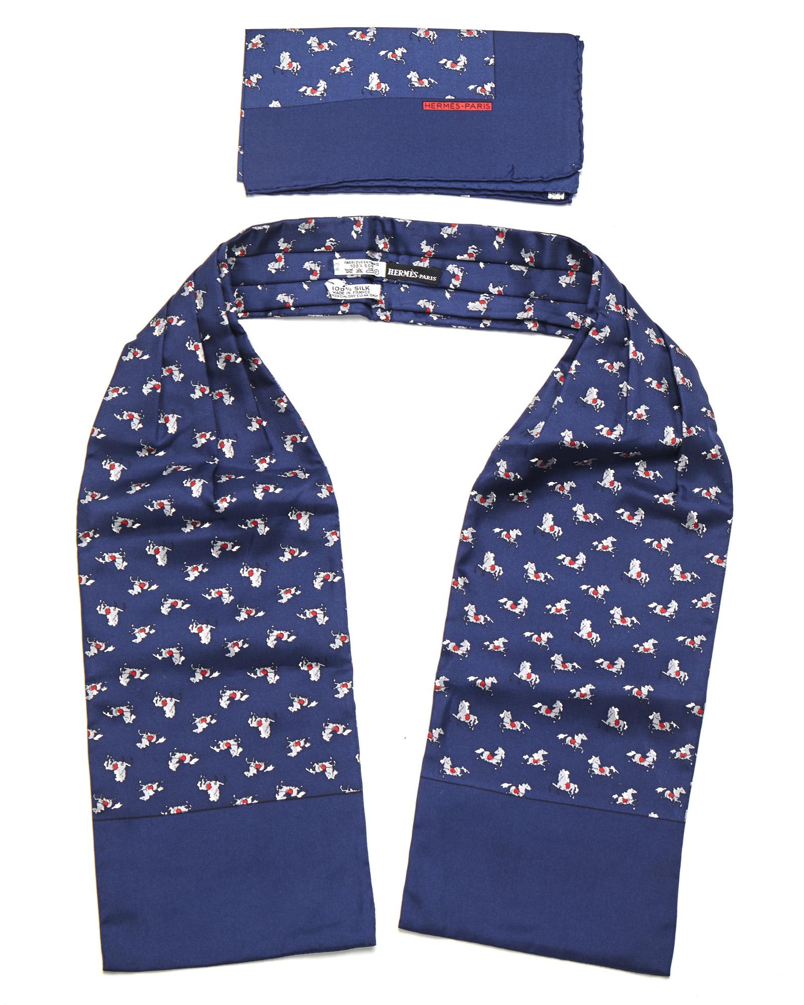 Two Hermes gent's accessories: Fourth quarter 20th century Fabric label: Hermes Paris Comprising a pocketsquare and ascot each in a navy horse pattern, 2 pieces Ascot: 44.5" H x 6.325" W