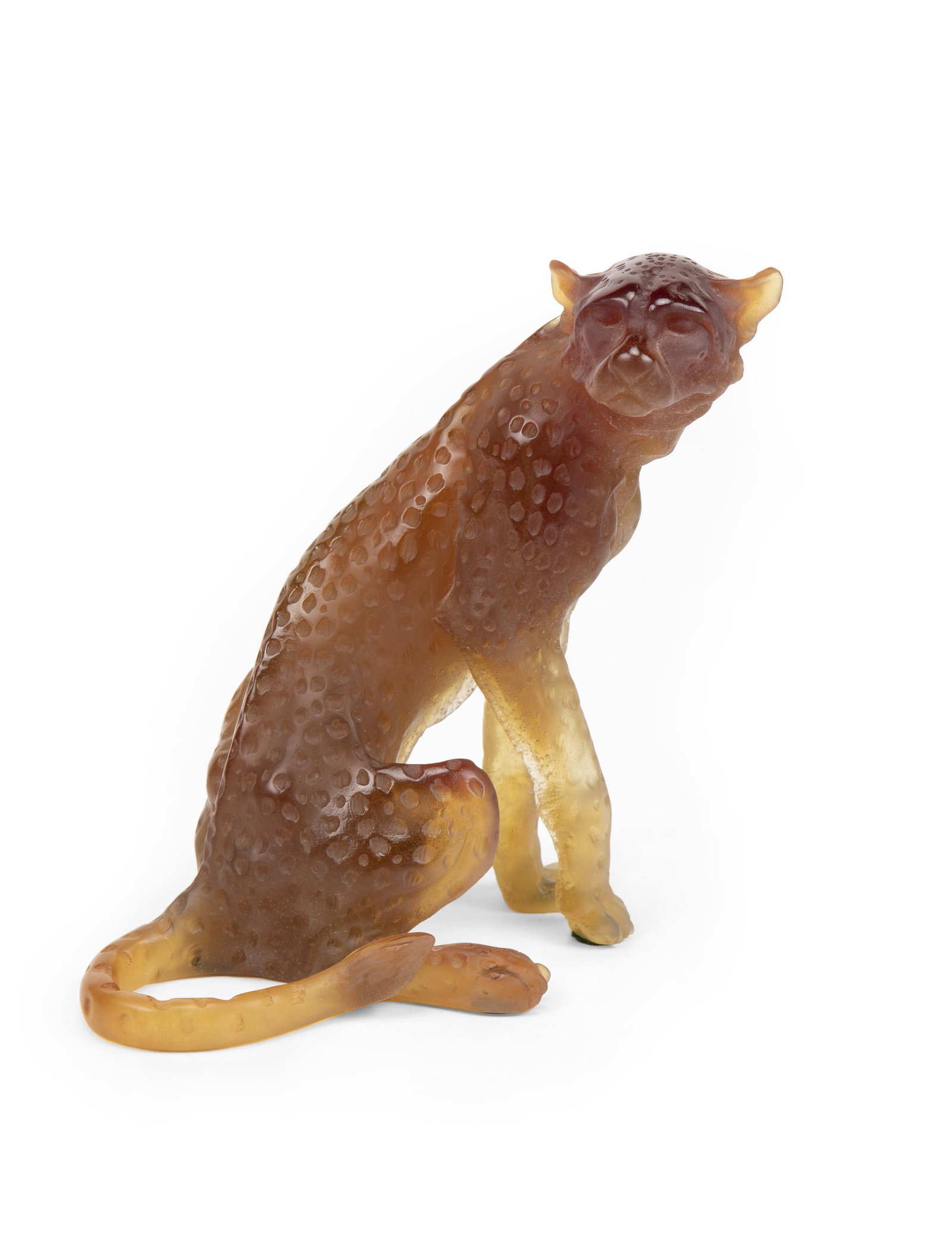A Daum amber pate de verre glass cheetah: Fourth-quarter 20th Century Signed and editioned to tail: Daum / France / 241/1000 The limited edition "Guepard" sculpture by Jean-Francois Leroy depicting a seated cheetah 10.75" H x 11" W x 6.5" D P