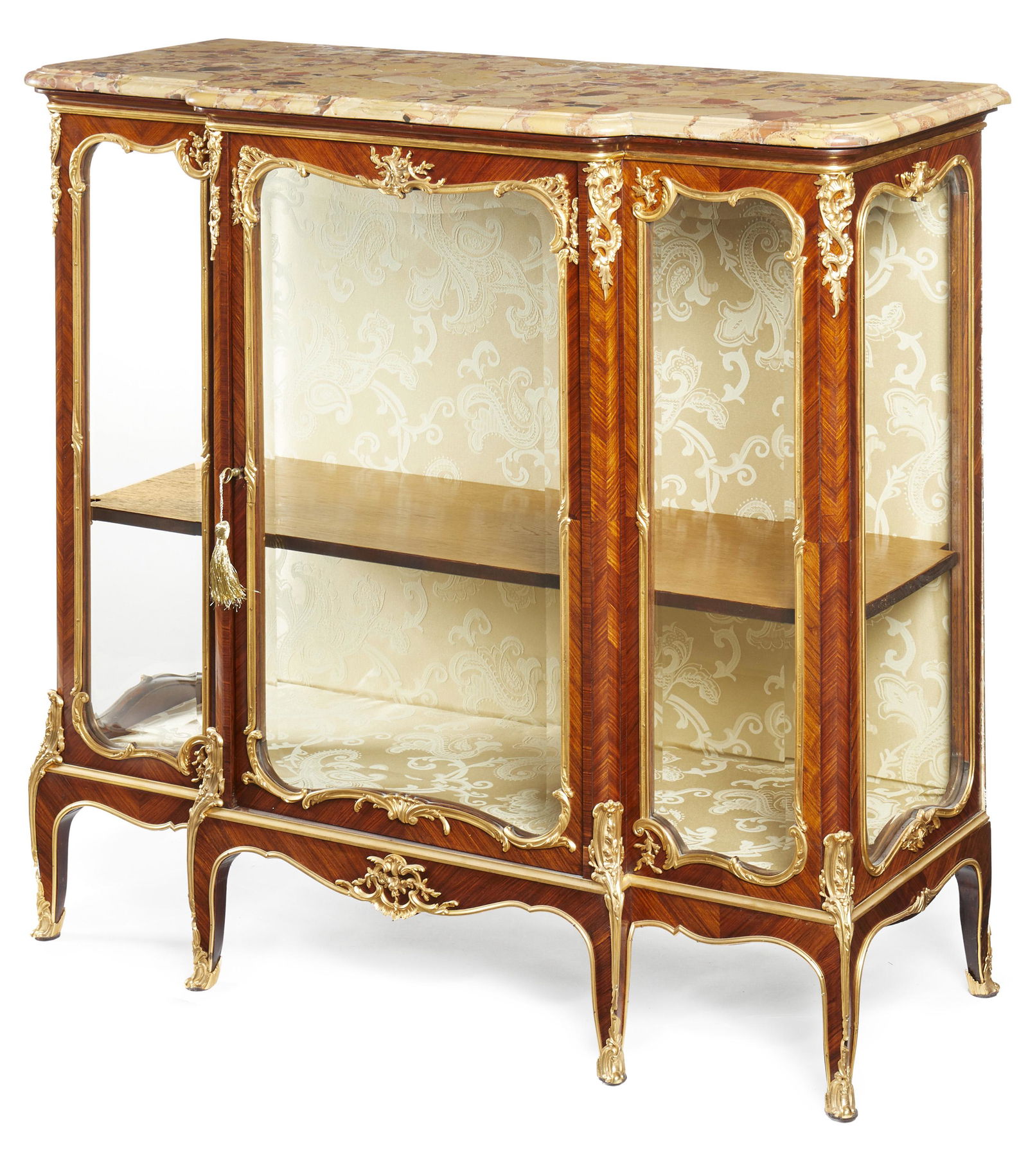A Francois Linke vitrine cabinet: Late-19th/early-20th Century Signed to top right mount: F Linke The breche d'alep marble top over gilt bronze-mounted vitrine cabinet with ivory silk interior and one fitted adjustable shelf 42.5"
