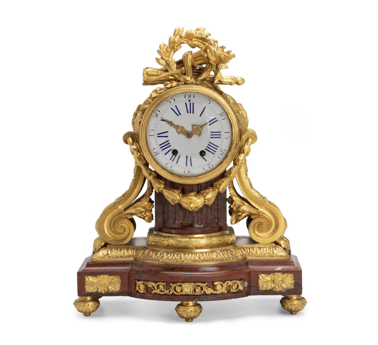 A French red rouge marble and gilt-bronze clock: Fourth-quarter 19th Century Stamped to mechanism: 2111 / ND The rouge marble base with bronze bow and arrow, laurel wreath, and torch over a white dial with Roman and Arabic numeral markers and bronze