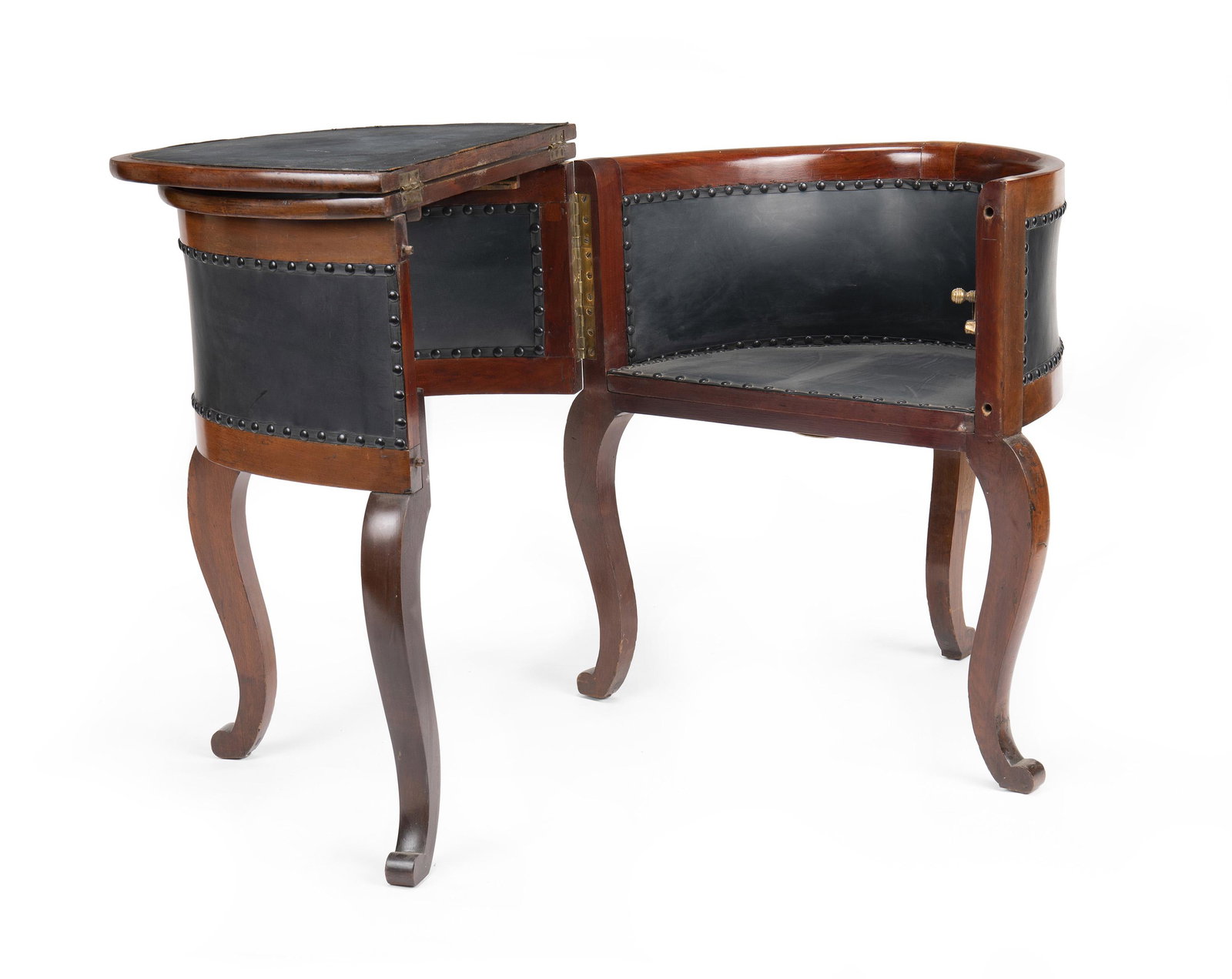 An English William IV mahogany chair and desk: 19th Century The oval table opens with hinged side to become an assistant's writing desk and chair with leather writing surface and studded leather detailing 30" H x 25.5" W x 34" D