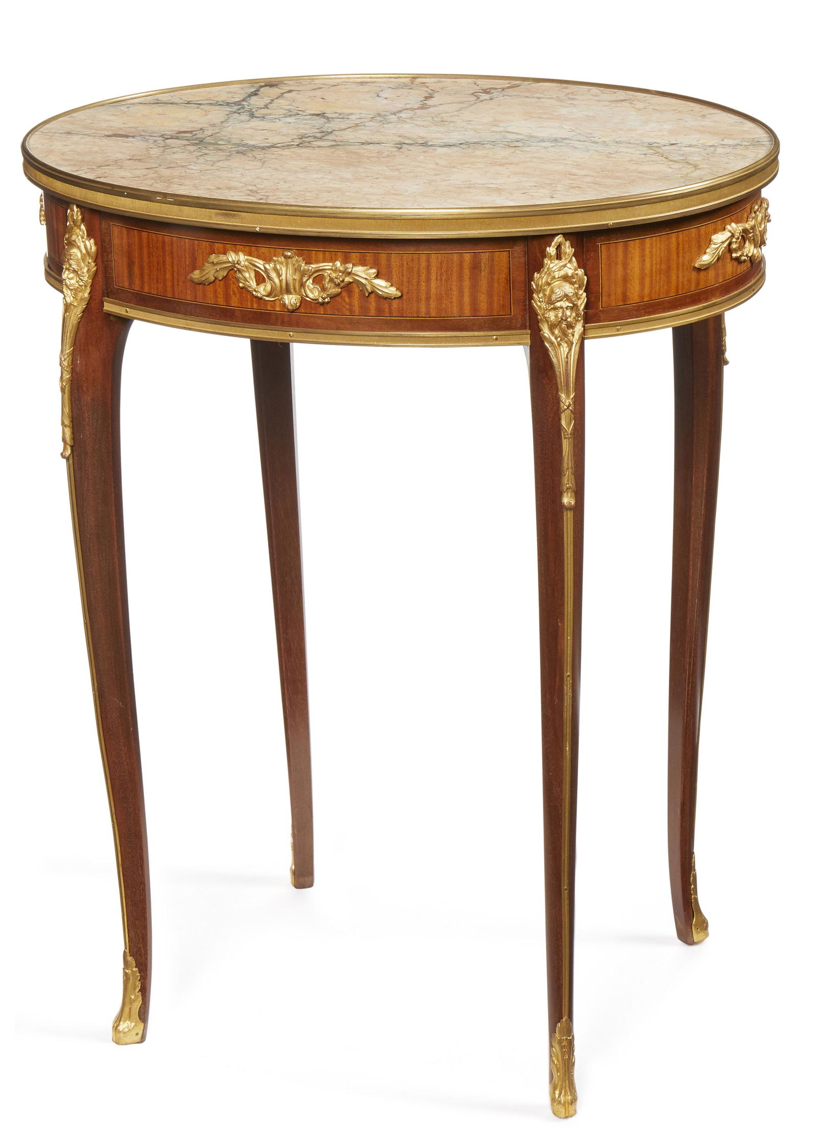 A Francois Linke marble top gueridon table: Late-19th/early-20th Century Signed to mount: F Linke The oval marble top over a gilt-bronze mounted apron, cabriole legs, and terminating in hoof-shaped caps 29" H x 23.75" W x 18" D