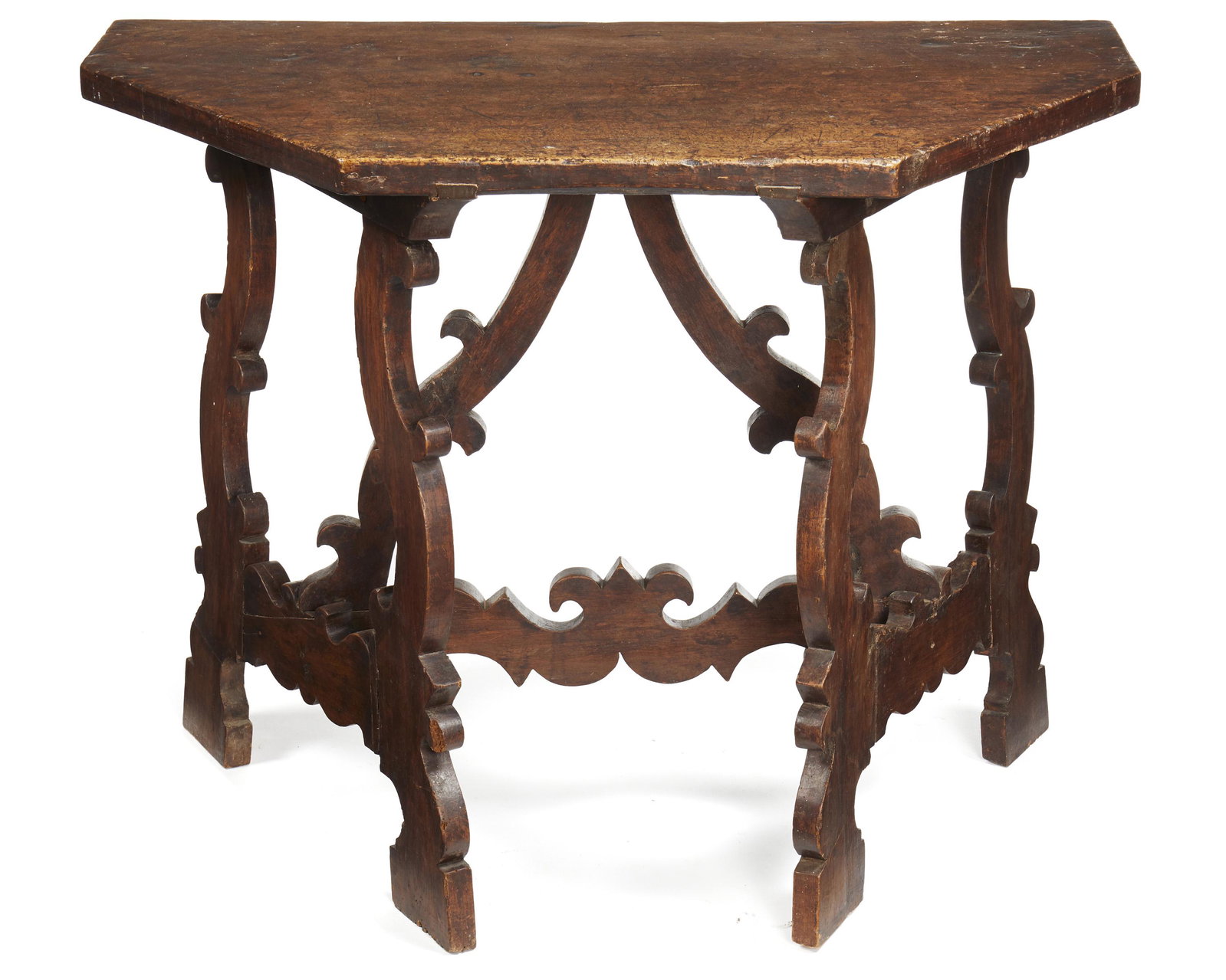 A Spanish Renaissance console: 18th/19th century The console table over carved legs and crossed decorative stretcher bars each with large geometric scrolled design 29.625" H x 39" W x 22.25" D