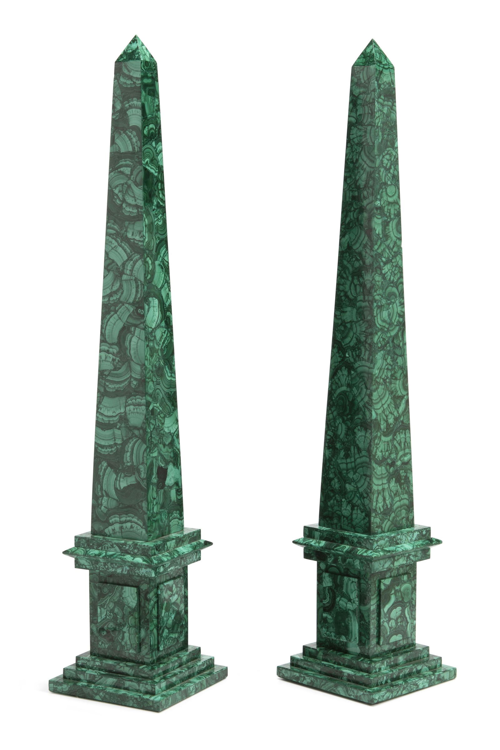 A pair of malachite veneered obelisks: 20th Century Unmarked The Russian-style malachite veneered obelisks each raised on a stepped base, 2 pieces 30" H x 6" W x 6" D
