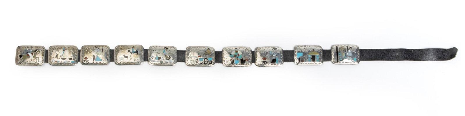 A Navajo Benjamin Becenti concho belt: Stamped: BB The buckle and conchos designed with scenes of daily life inlaid with stones 45.25" L x 2.125" H; Buckle: 2.125" H x 3" W