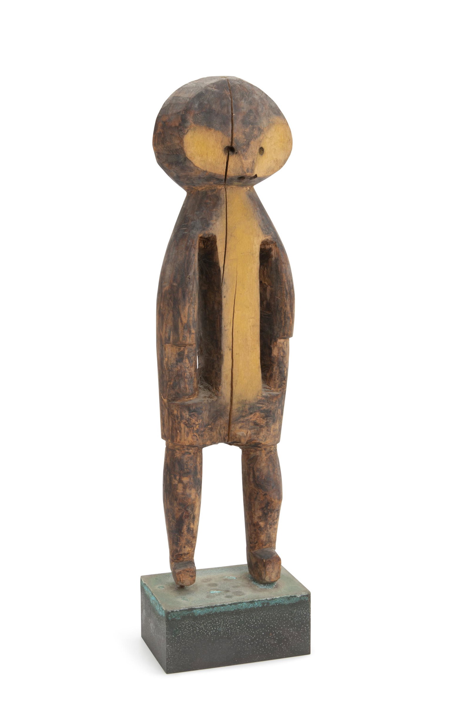 An African male fetish figure: 20th Century; Mbole people, Democratic Republic of Congo The carved wood figure with egg shaped head and heart shaped face, face and torso painted with yellow ochre 15.5" H x 4.5" W x 2" D Provenance: