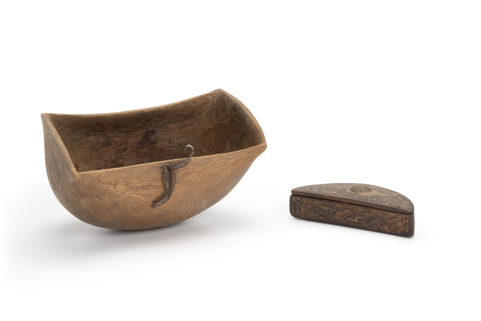 Two African wood items: Late-19th/early-20th Century; Central Africa Comprising a Kenyan Turkana rectangular wood bowl together with a Kuba cosmetic box with incised overall textile designs, 2 pieces Larger: 6.5" H x 6.5" W 