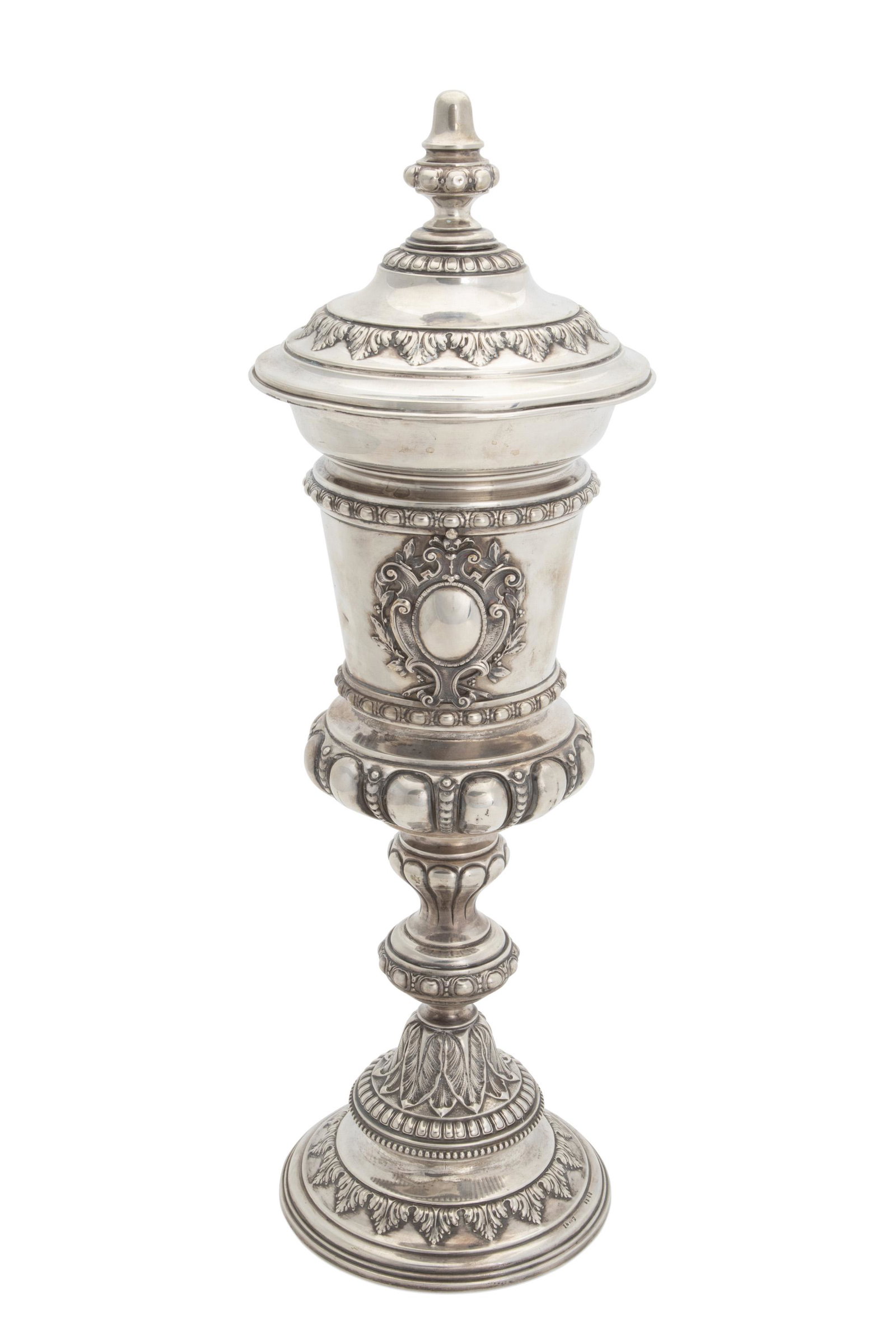 A German H. Meyen & Co. .800 silver urn: Late 19th/early 20th century Stamped for H. Meyen & Co.; Further stamped: 800 2312 The non-functioning lid over a gadrooned body centering a cartouche over a knopped standard 19.625" H x 6" Dia. 30.0 