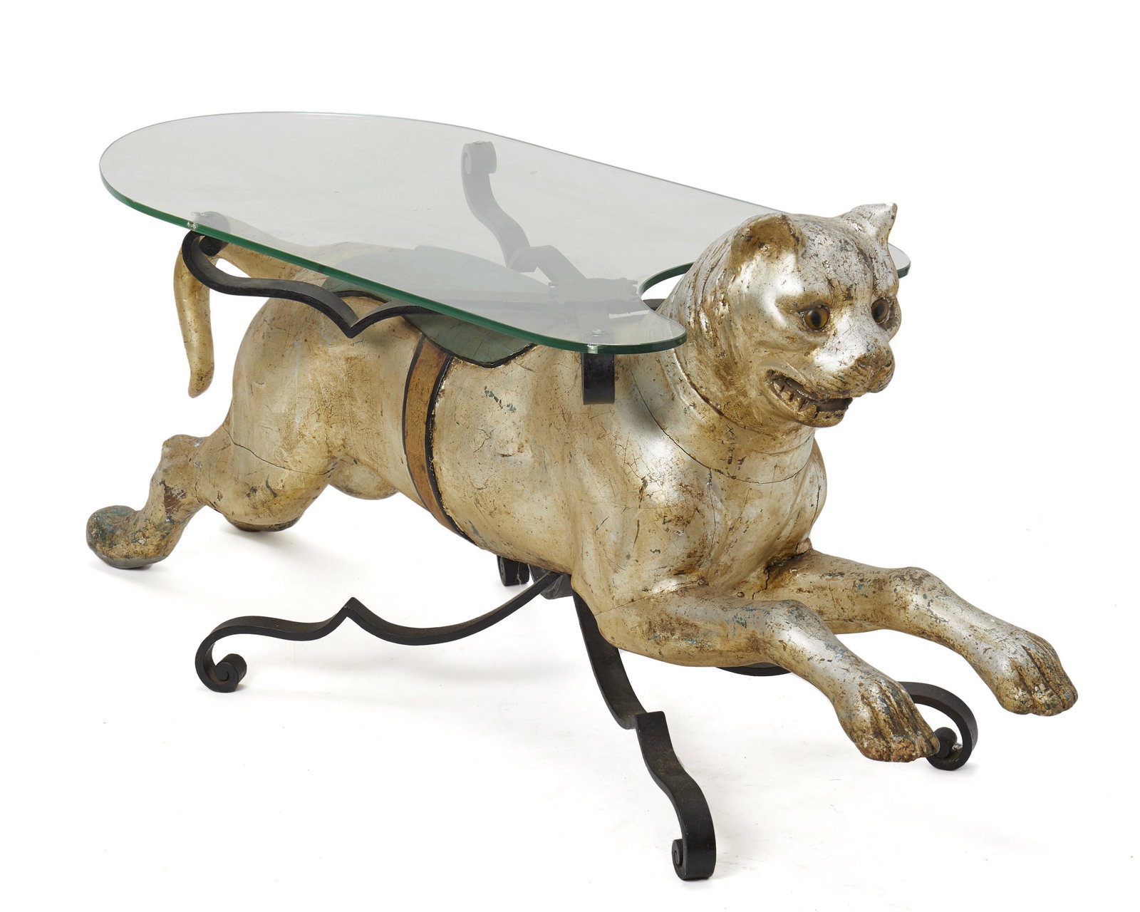 A figural cocktail table: 20th Century Made from a carved wood and painted carousel cat with a glass top Base: 24.75" H x 51" W x 17.25" D