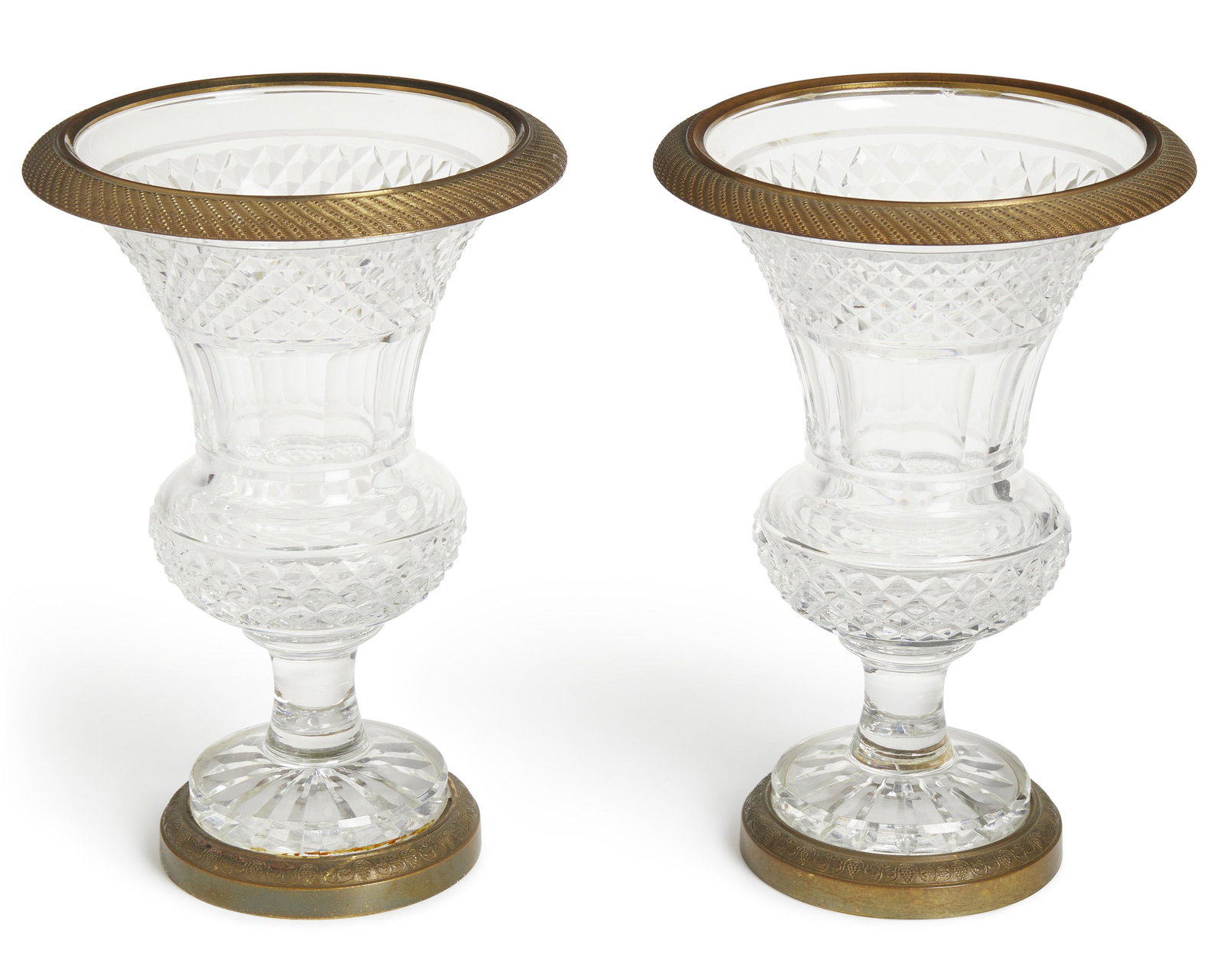 A pair of Empire-style bronze mounted cut crystal vases: Early-20th Century Each baluster-formed vase with bronze mounted rim and foot, 2 pieces Each approximately: 9.75" H x 6" W x 3.75" D