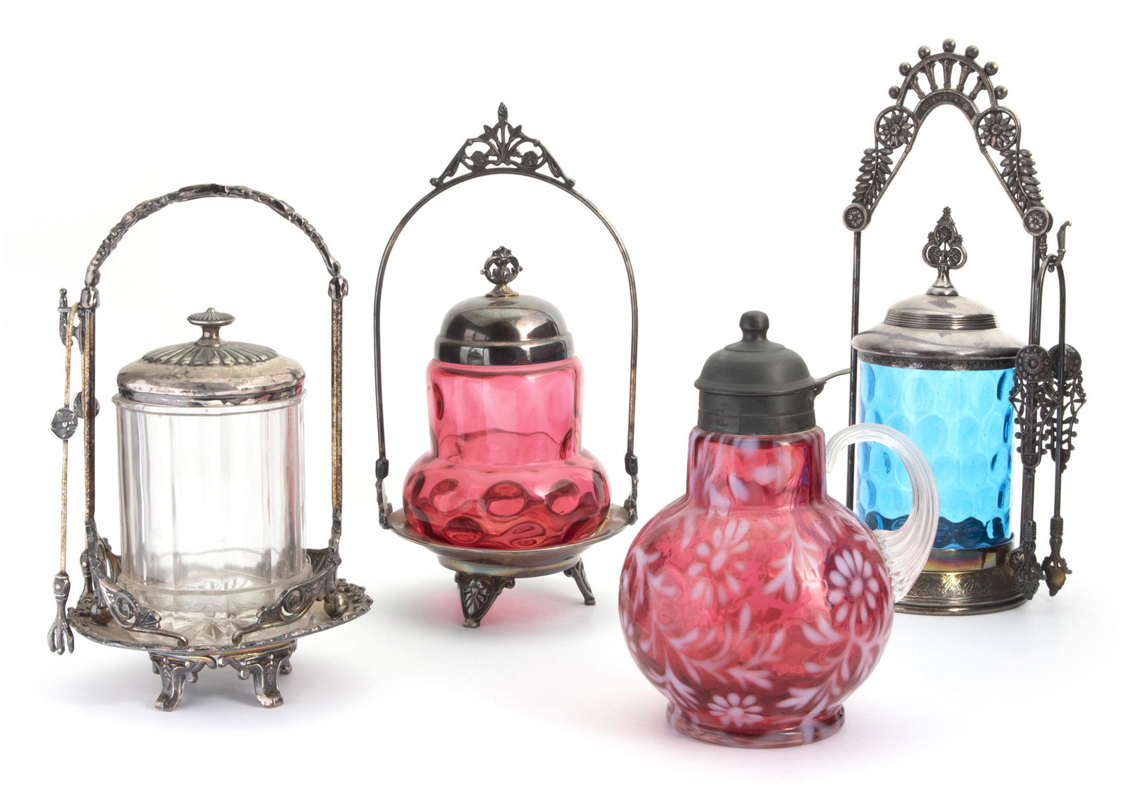 A group of Victorian glass tableware: Late 19th/early 20th Century Some marked for silverplate Comprising three pickle castors with floral motifs, two pickle tongs and one condiment pitcher; marks for makers include Meriden Silver Plate C