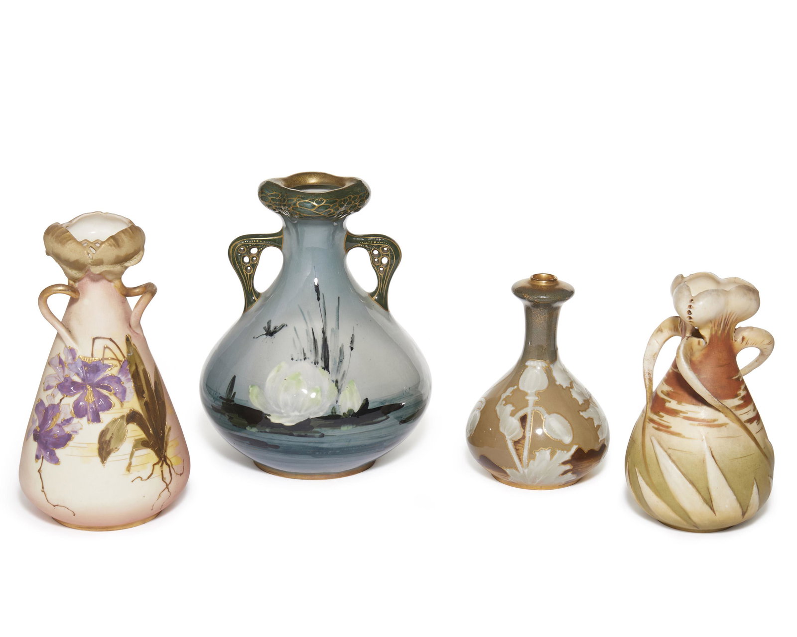 A group of Teplitz and Amphora vases: Late-19th/early-20th Century; Austria Three marked: Turn-Teplitz Bohemia; One marked for Amphora Three Teplitz vases with one Amphora vase each designed with Art Nouveau flowers Largest: 7.5" H x 5.5"
