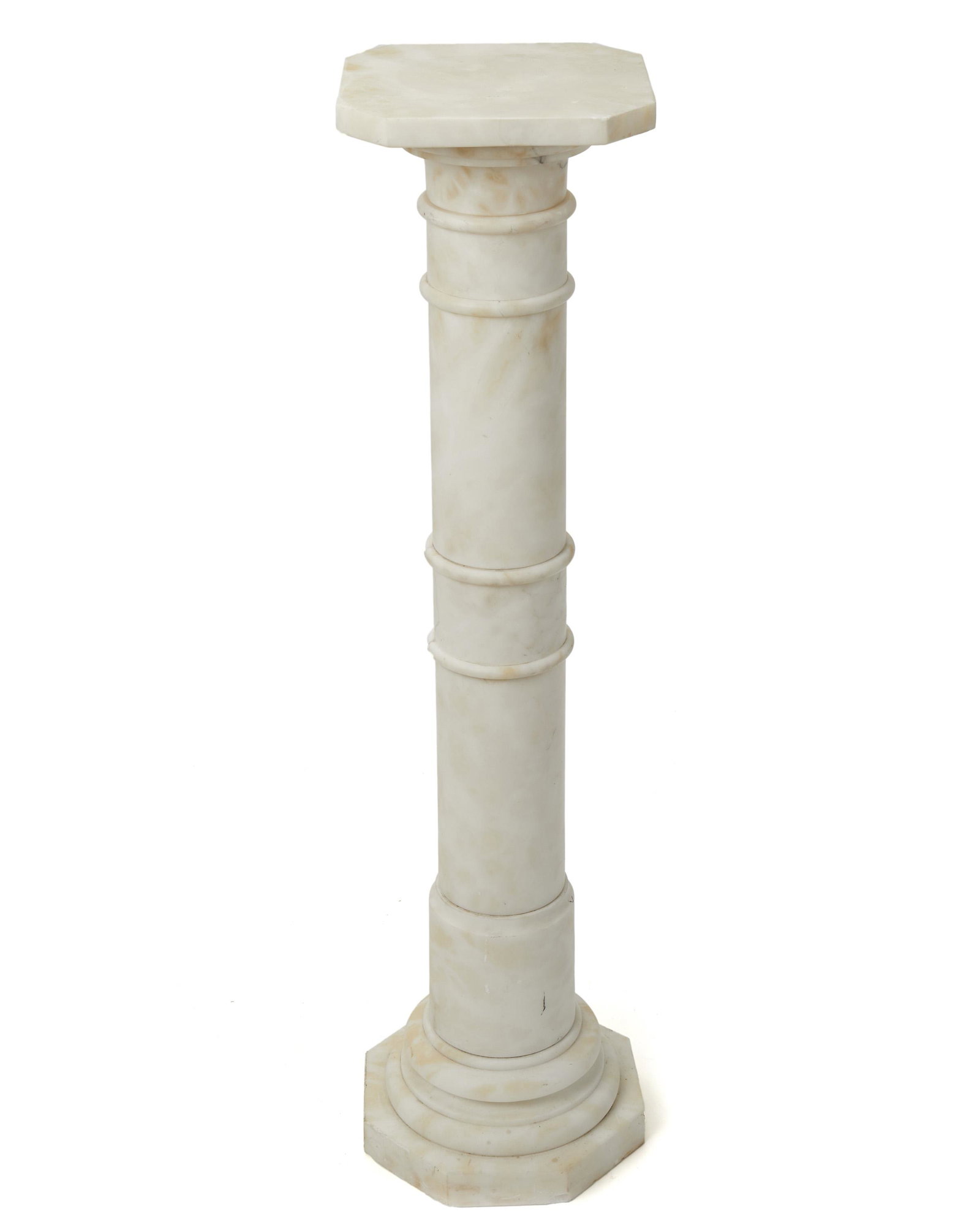 A white marble pedestal: 20th Century Chamfered square top over a columnar standard and octagonal base 42" H x 11" W x 11" D