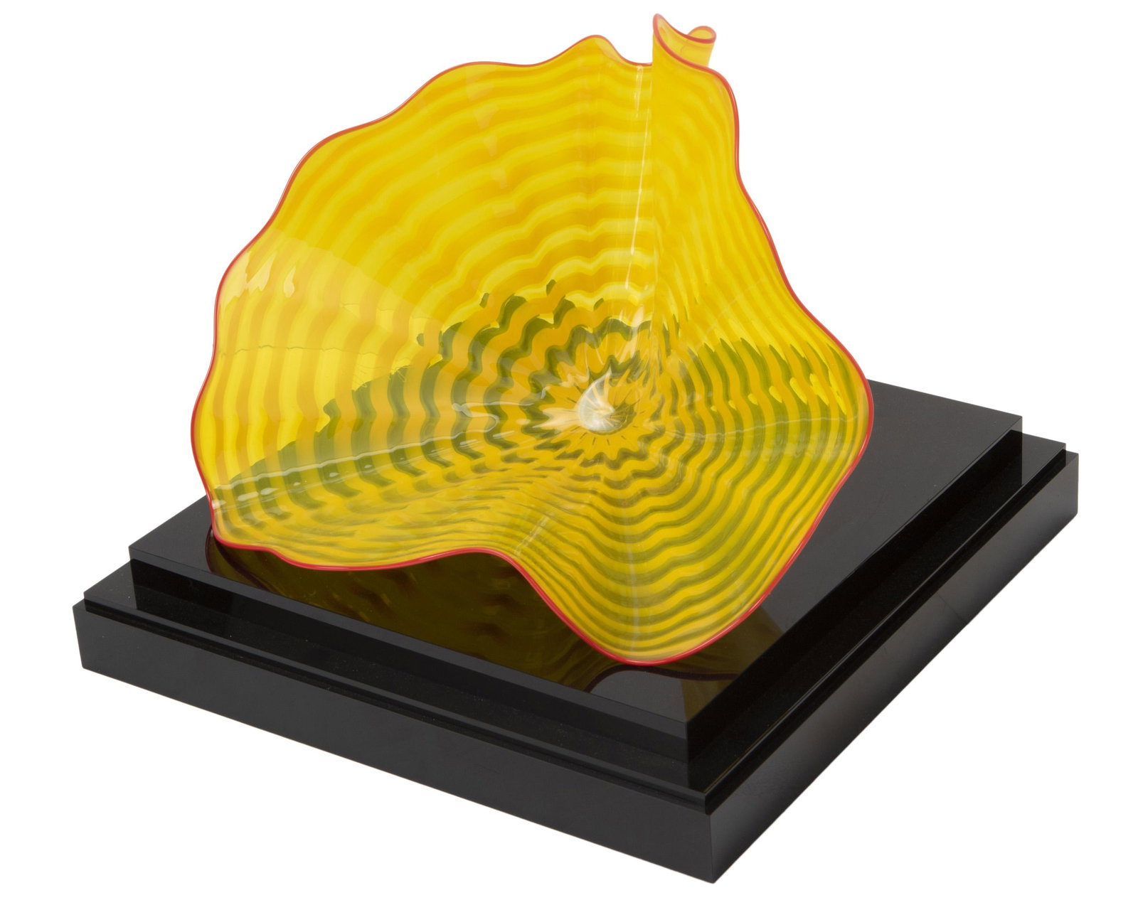 Dale Chihuly (b. 1941, American): "Persian" glass bowl Striped yellow glass with red lip on acrylic base Signed and inscribed: Chihuly / PP08 8" H x 12.5" W x 9" D