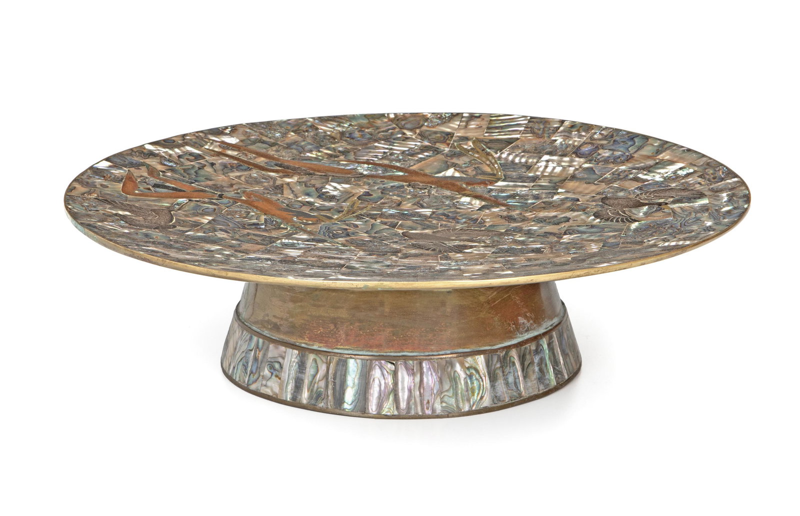 An abalone-inlay mixed-metal pedestal serving plate: Mid-20th century, Mexico Apparently unsigned Possibly Los Castillo, designed with figures hunting ducks 3.75" H x 13.75" Dia.